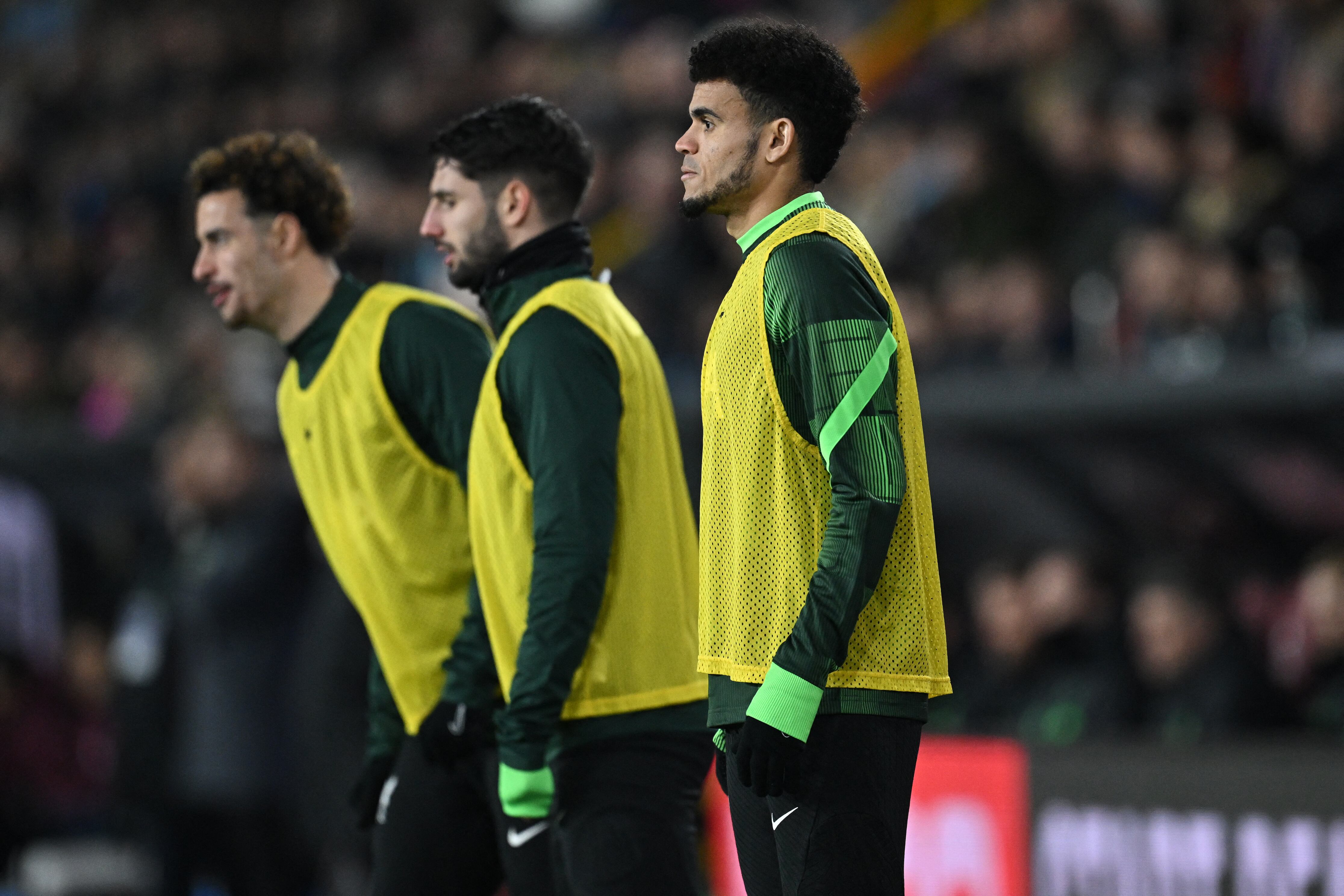 Liverpool's English midfielder #17 Curtis Jones (L), Liverpool's Hungarian midfielder #08 Dominik Szoboszlai (C) and Liverpool's Colombian midfielder #07 Luis Diaz (R) warm up during the English Premier League football match between Burnley and Liverpool at Turf Moor in Burnley, north-west England on December 26, 2023. (Photo by Paul ELLIS / AFP) / RESTRICTED TO EDITORIAL USE. No use with unauthorized audio, video, data, fixture lists, club/league logos or 'live' services. Online in-match use limited to 120 images. An additional 40 images may be used in extra time. No video emulation. Social media in-match use limited to 120 images. An additional 40 images may be used in extra time. No use in betting publications, games or single club/league/player publications. /