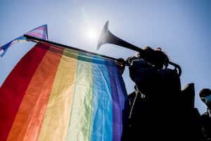 ISTANBUL, TURKEY - 2021/03/27: A protester seen playing a trombone draped in an LGBTI+ flag during the demonstration.
Bosphorus University students staged yet another protest in Istanbul against the appointment of a governing party member as their rector by President Recep Tayyip Erdogan. (Photo by Murat Baykara/SOPA Images/LightRocket via Getty Images)