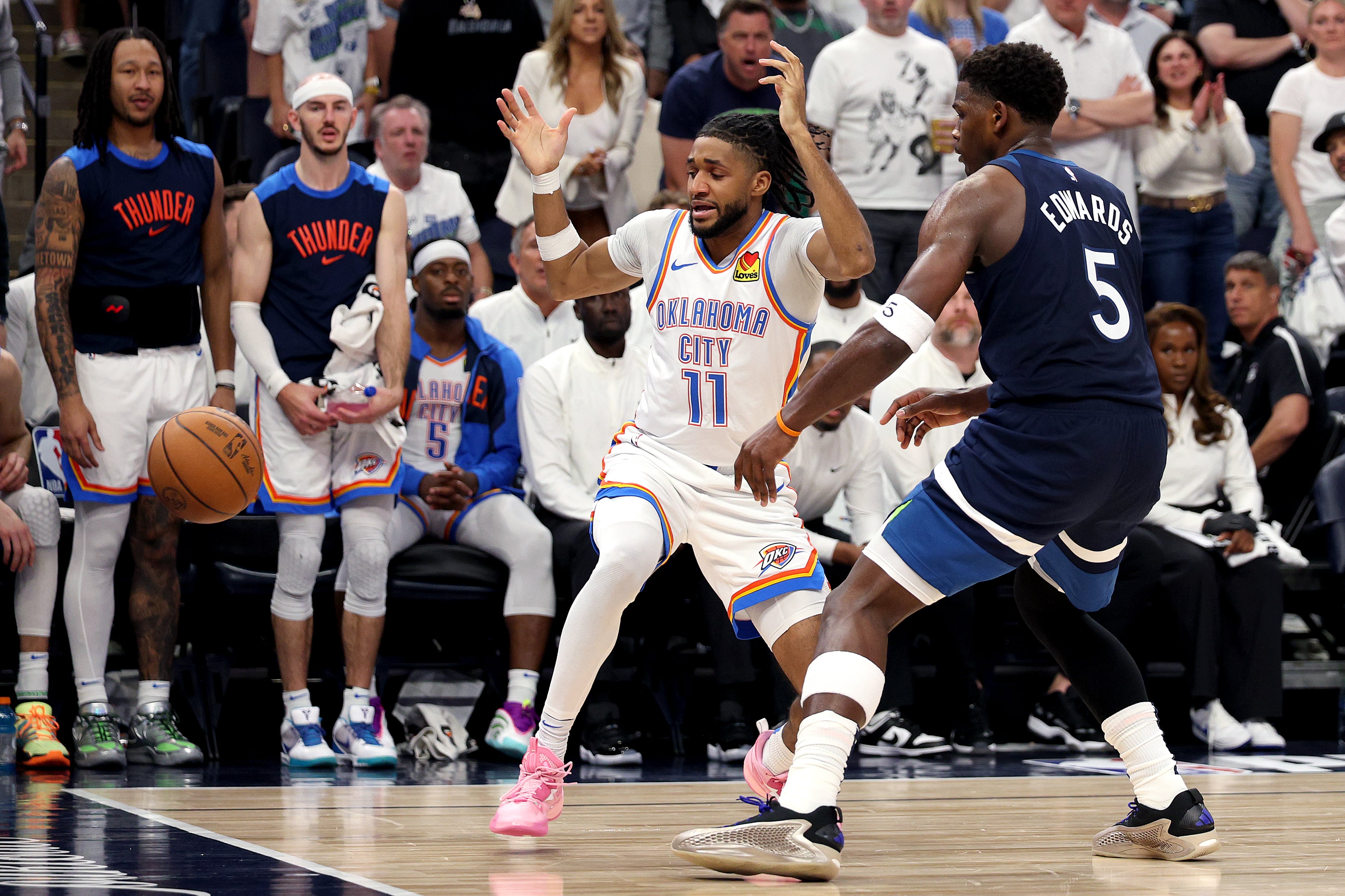 MINNEAPOLIS, MINNESOTA - MAY 26: Isaiah Joe #11 of the Oklahoma City Thunder turns the ball over against Anthony Edwards #5 of the Minnesota Timberwolves during the third quarter in Game Four of the Western Conference Finals of the 2025 NBA Playoffs at Target Center on May 26, 2025 in Minneapolis, Minnesota. NOTE TO USER: User expressly acknowledges and agrees that, by downloading and or using this photograph, User is consenting to the terms and conditions of the Getty Images License Agreement. (Photo by David Berding/Getty Images)