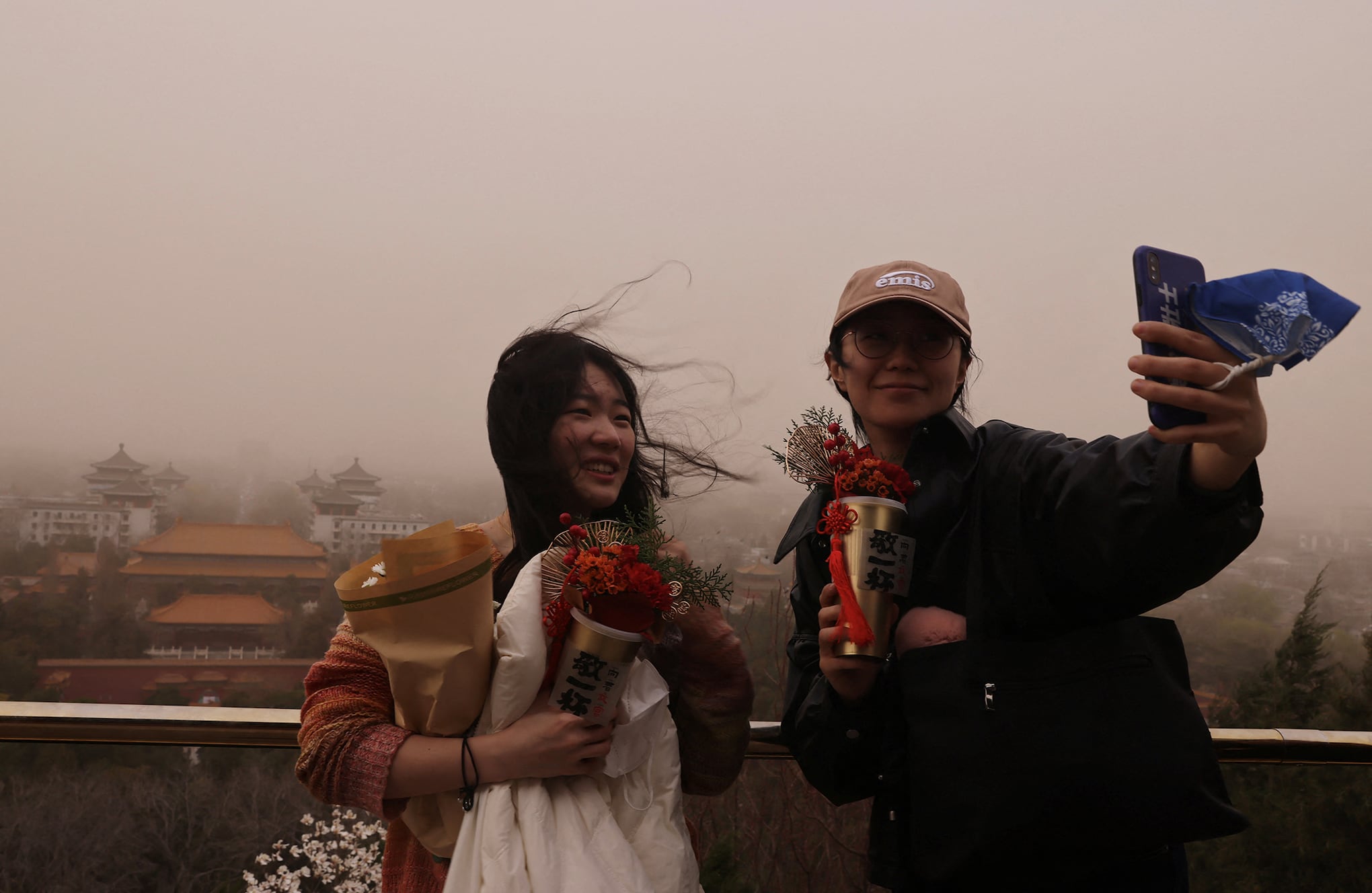 En imágenes : Tormenta de arena y contaminación en los cielos de Beijing