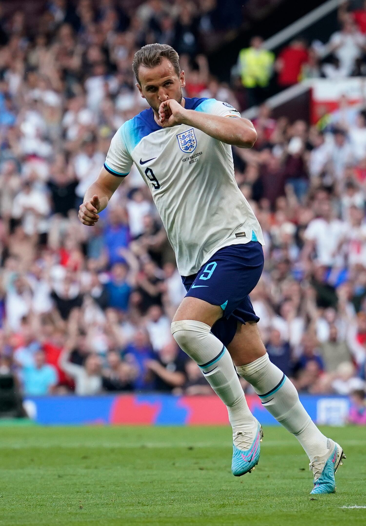England's Harry Kane celebrates after scoring the opening goal during the Euro 2024 group C qualifying soccer match between England and North Macedonia at Old Trafford in Manchester, Monday June 19, 2023. (AP Photo/Dave Thompson)
