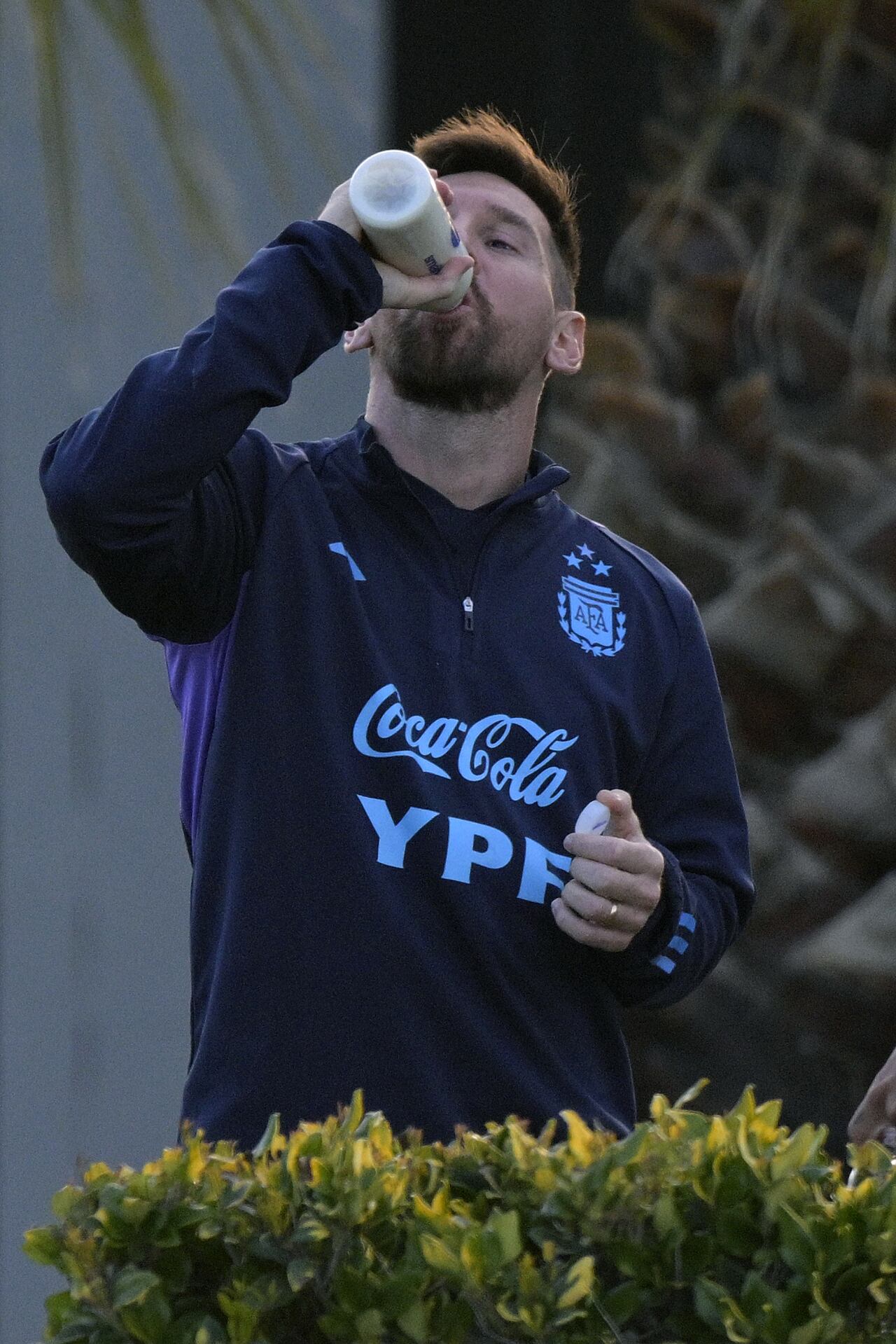 Argentina's forward Lionel Messi drinks a brebage during a training session in Ezeiza, Buenos Aires, on September 5, 2023, ahead of FIFA World Cup 2026 qualifier football matches against Ecuador on September 7 in Buenos Aires and with Bolivia on September 12 in La Paz. (Photo by JUAN MABROMATA / AFP)