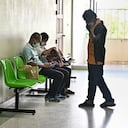 People wait to hear news on the status of their relatives, who were injured in a mass shooting by a former police officer at a nursery, in a hospital in Thailand's northeastern Nong Bua Lam Phu province on October 7, 2022. - Weeping, grief-stricken families gathered on October 7 outside a Thai nursery where an ex-policeman murdered nearly two dozen young children in one of Thailand's worst mass killings. (Photo by Lillian SUWANRUMPHA / AFP)