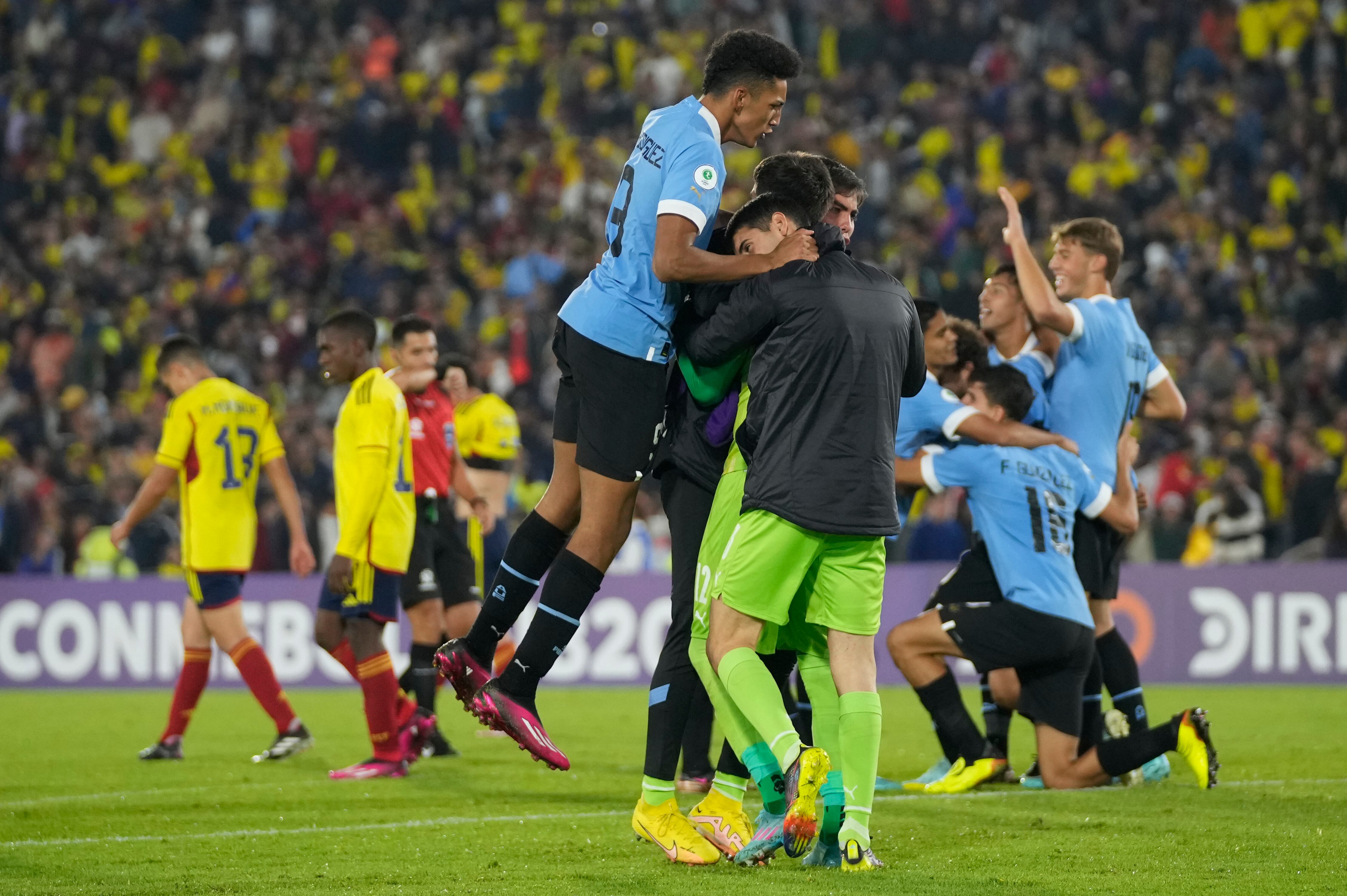 Uruguayan players celebrate at the end of a South America U-20 Championship soccer match against Colombia in Bogota, Colombia, Tuesday, Jan. 31, 2023. Uruguay won 1-0. (AP Photo/Fernando Vergara)