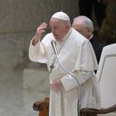 Pope Francis makes the sign of the cross during the weekly general audience at Paul-VI hall in The Vatican on November 29, 2023. (Photo by Tiziana FABI / AFP)