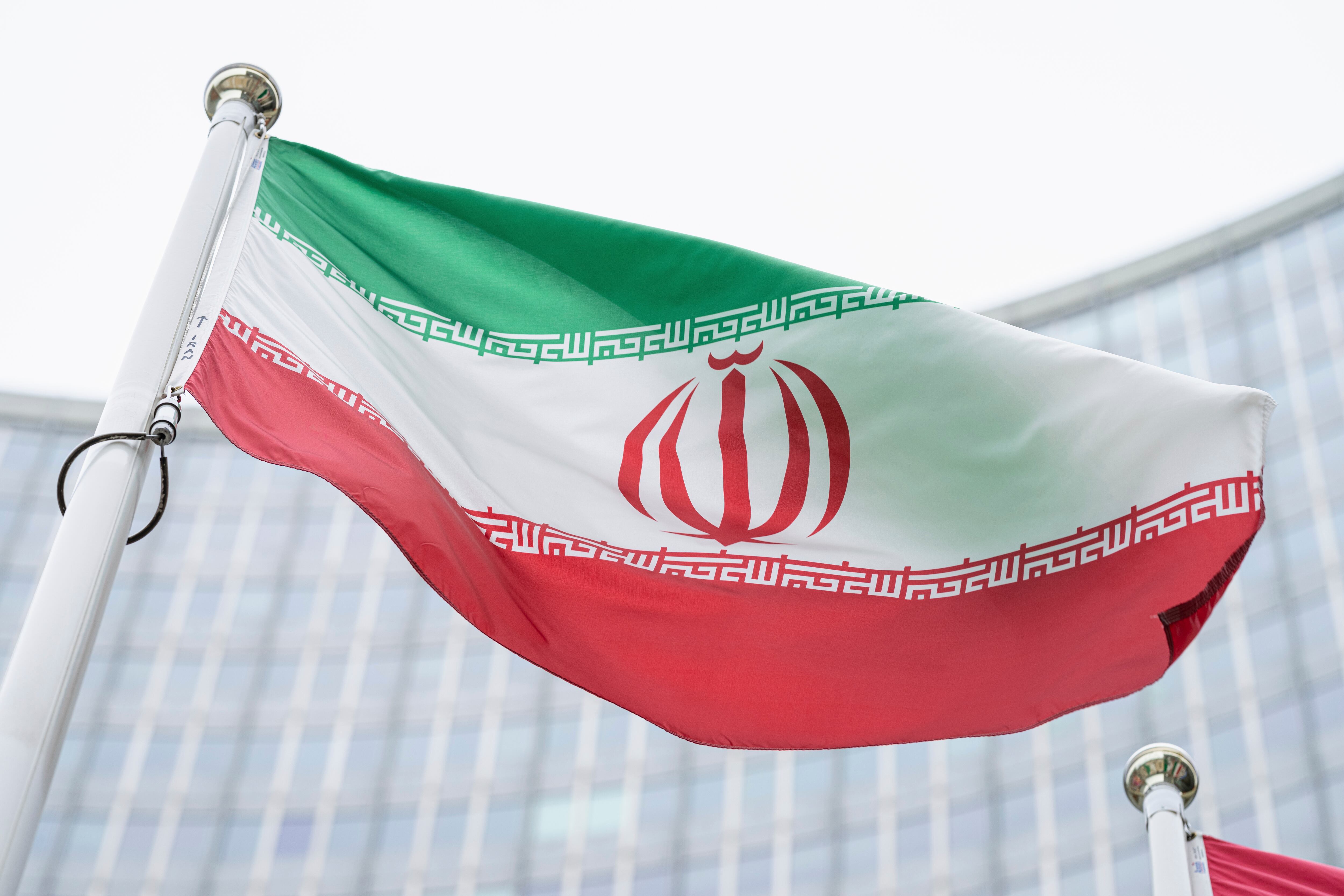FILE - In this Monday, May 24, 2021 file photo, the flag of Iran waves in front of the the International Center building with the headquarters of the International Atomic Energy Agency, IAEA, in Vienna, Austria, Monday, May 24, 2021.  The United Nations’ International Atomic Energy Agency watchdog reported Monday May 31, 2021, it hasn't been able to access data important to monitoring Iran’s nuclear program since late February when the Islamic Republic started restricting international inspections of its facilities.  (AP Photo/Florian Schroetter, FILE)