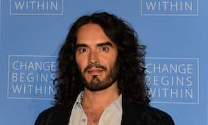(FILES) Actor Russell Brand poses on arrival with director David Lynch (not pictured) to launch �Meditation in Education�, a Global Outreach campaign to teach 1,000,000 at-risk youth "Meditation in Education" on April 2, 2013 in Los Angeles, California. British comedian and actor Russell Brand has been accused of rape, sexual assaults and emotional abuse during a seven-year period, according to the results of a media investigation published on September 16, 2023. (Photo by Frederic J. BROWN / AFP)