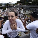 (FILES) Venezuela's radical opposition leader Maria Corina Machado gestures during a gathering with Venezuelan opposition leader Juan Guaido and thousands of supporters, in Caracas on February 2, 2019. The pre-candidate for the presidential elections scheduled for 2024 in Venezuela, Maria Corina Machado, of the most radical wing of the opposition, was disqualified from holding public office for 15 years, according to a document from the pro-government Comptroller General's Office released on June 30, 2023. (Photo by Federico PARRA / AFP)