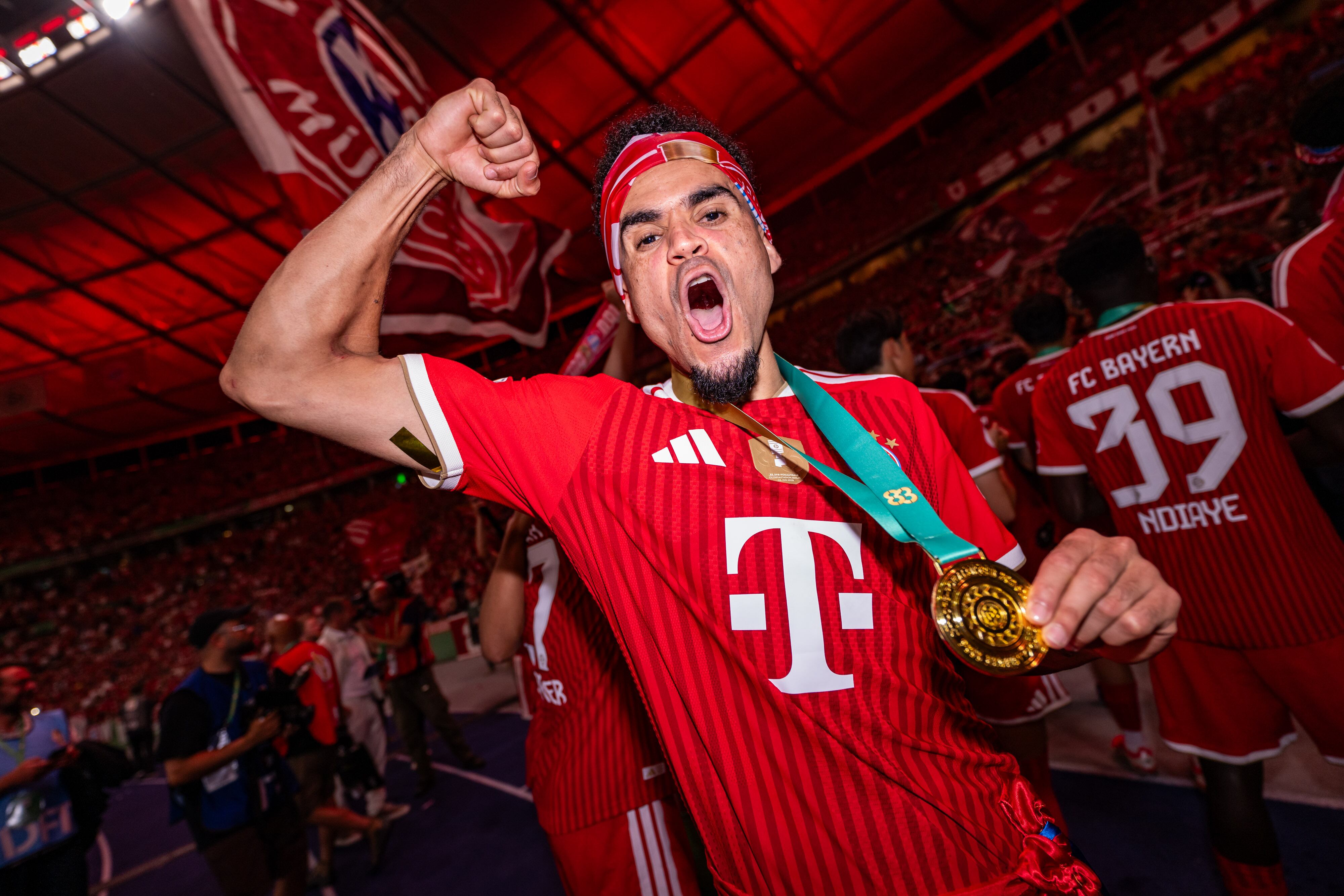 BERLIN, GERMANY - MAY 23: Luis Diaz of FC Bayern Muenchen celebrates with the Fans and Teammates following the DFB Cup Final 2026 match between FC Bayern München and VfB Stuttgart at Olympiastadion on May 23, 2026 in Berlin, Germany. (Photo by Kevin Voigt/GettyImages)