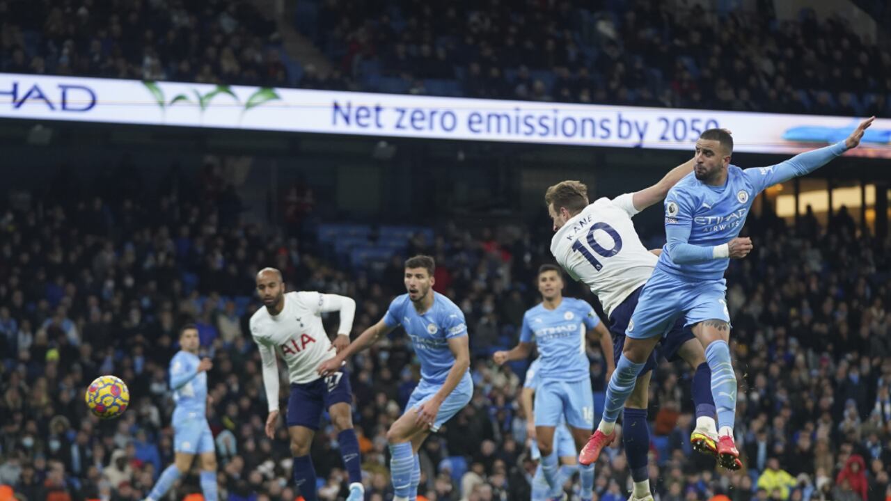 Tottenham's Harry Kane, second right, scores his side's third goal during the English Premier League soccer match between Manchester City and Tottenham Hotspur, at the Etihad stadium in Manchester, England, Saturday, Feb. 19, 2022. (AP/Jon Super)