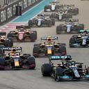 Mercedes driver Lewis Hamilton of Britain in leads Red Bull driver Max Verstappen of the Netherlands at the start of the Formula One Abu Dhabi Grand Prix in Abu Dhabi, United Arab Emirates, Sunday, Dec. 12. 2021. Max Verstappen ripped a record eighth title away from Lewis Hamilton with a pass on the final lap of the Abu Dhabi GP to close one of the most thrilling Formula One seasons in years as the first Dutch world champion. (AP Photo/Hassan Ammar)