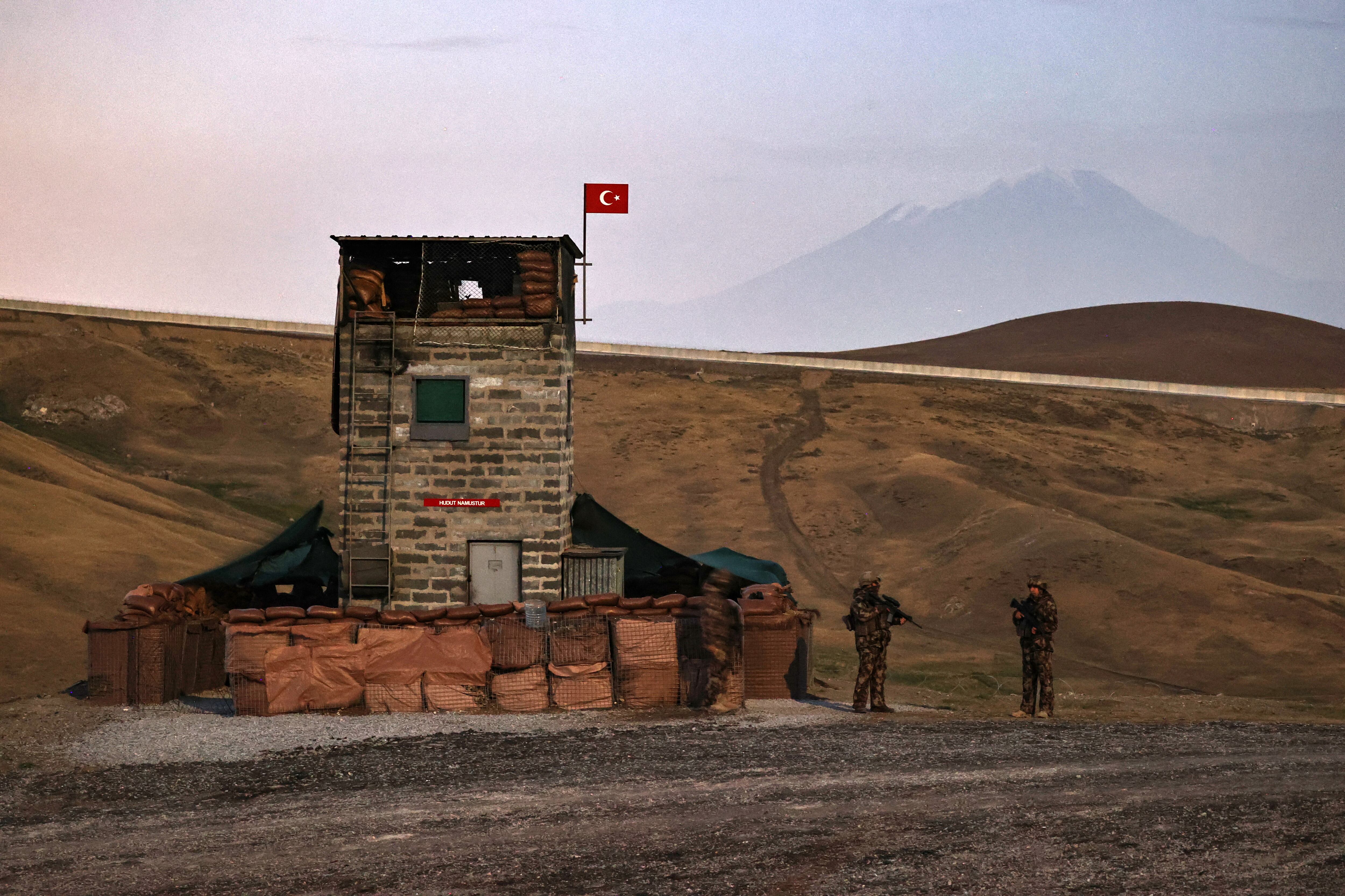 VAN, TURKEY - AUGUST 18: Turkish security forces control the border with Iran to prevent illegal crossings and smuggling as well as terrorists as modular wall, observation tower construction and trench works continue in Van, Turkey on August 18, 2021. Gendarmerie, Land Forces units, special operations police and security guards immediately intervene in incidents they detect with thermal and night vision cameras and aircrafts. (Photo by Ozkan Bilgin/Anadolu Agency via Getty Images)