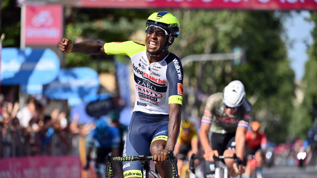 Eritrea's Biniam Girmay celebrates as he crosses the finish line of the 10th stage of the Giro D'Italia cycling race from Pescara to Jesi, Italy, Tuesday, May 17, 2022. (Massimo Paolone/LaPresse vida AP)