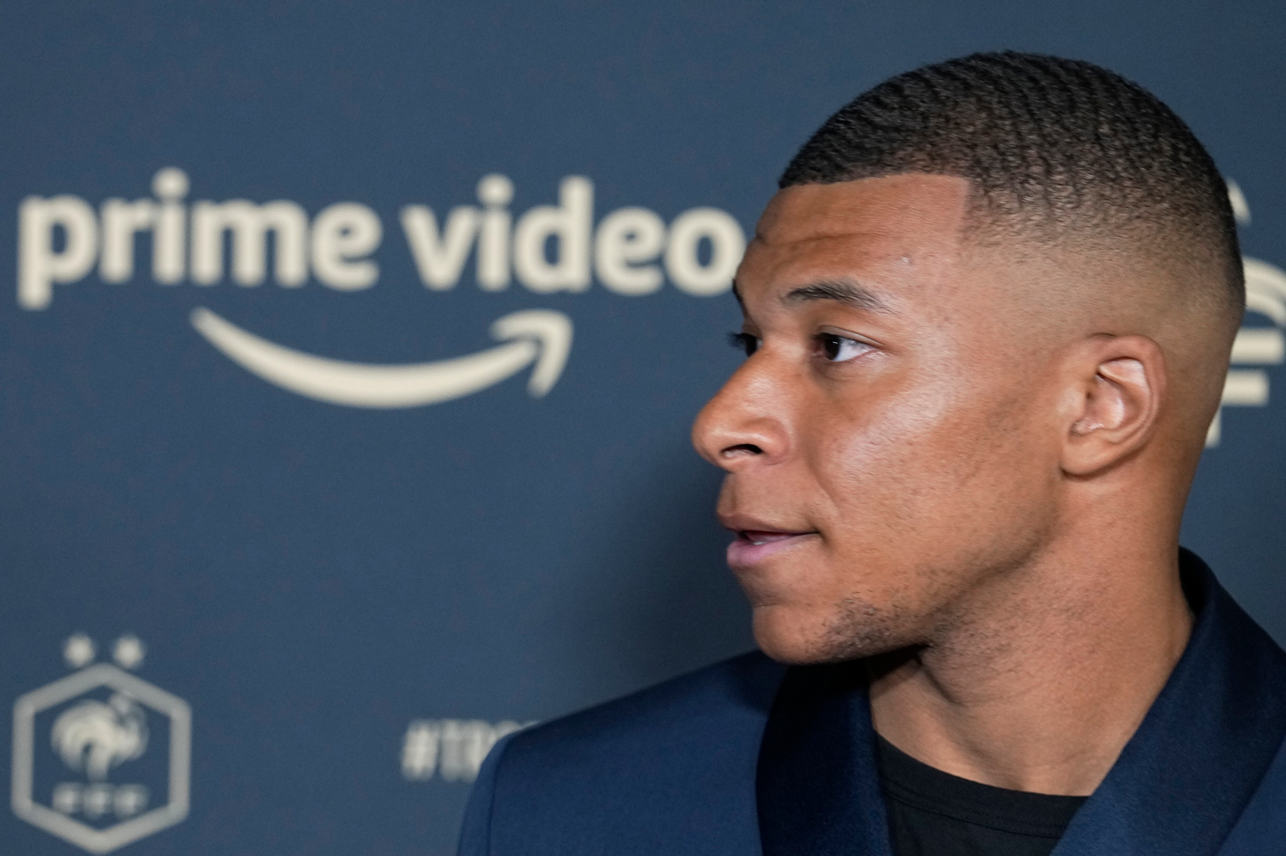 Paris Saint Germain's Kylian Mbappe poses as he arrives at the UNFP (Union of French Professional Footballers) ceremony, in Paris, France, Sunday, May 15, 2022. (AP Photo/Michel Euler)