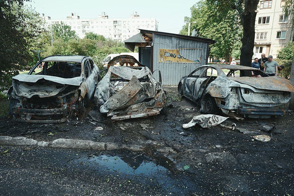KHARKIV, UKRAINE - JUNE 5: Burnt cars lie in the yard of residential district after a Russian night drone attack on June 5, 2025 in Kharkiv, Ukraine. 18 People, including four children, suffered acute stress reactions due to the Russian attack on the Slobidskyi District of Kharkiv, the Kharkiv region police reported. (Photo by Viktoriia Yakymenko/Suspilne Ukraine/JSC "UA:PBC"/Global Images Ukraine via Getty Images)