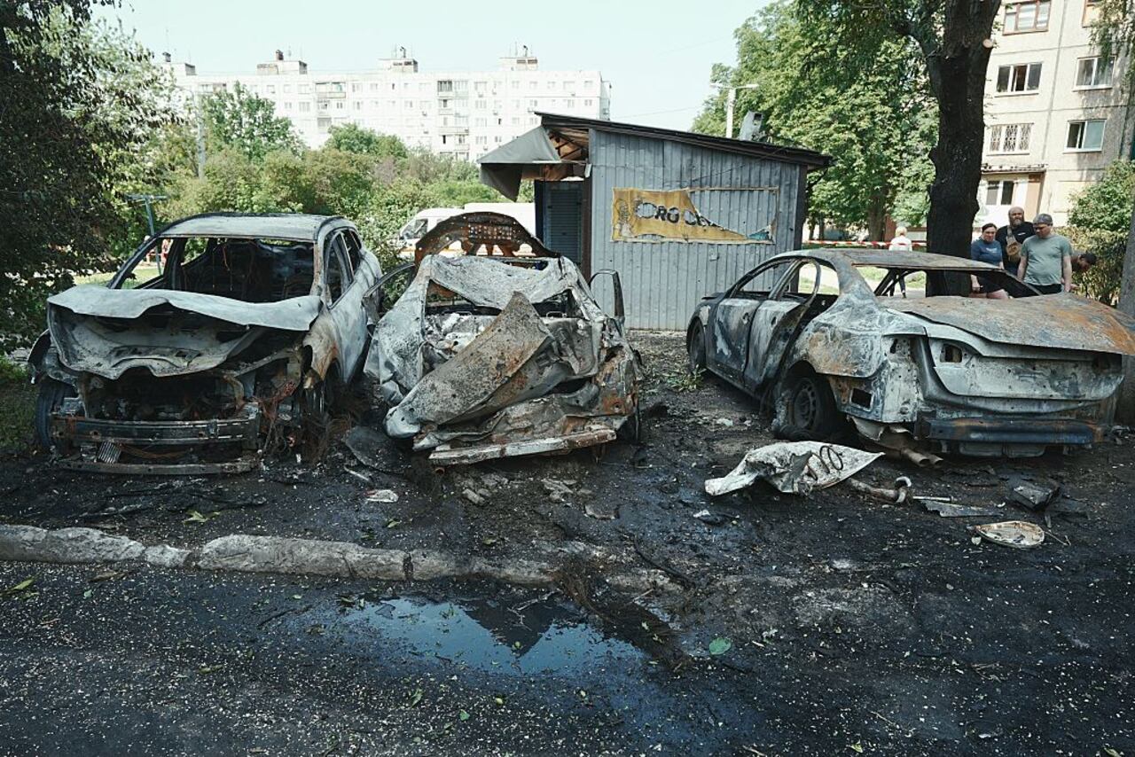 KHARKIV, UKRAINE - JUNE 5: Burnt cars lie in the yard of residential district after a Russian night drone attack on June 5, 2025 in Kharkiv, Ukraine. 18 People, including four children, suffered acute stress reactions due to the Russian attack on the Slobidskyi District of Kharkiv, the Kharkiv region police reported. (Photo by Viktoriia Yakymenko/Suspilne Ukraine/JSC "UA:PBC"/Global Images Ukraine via Getty Images)