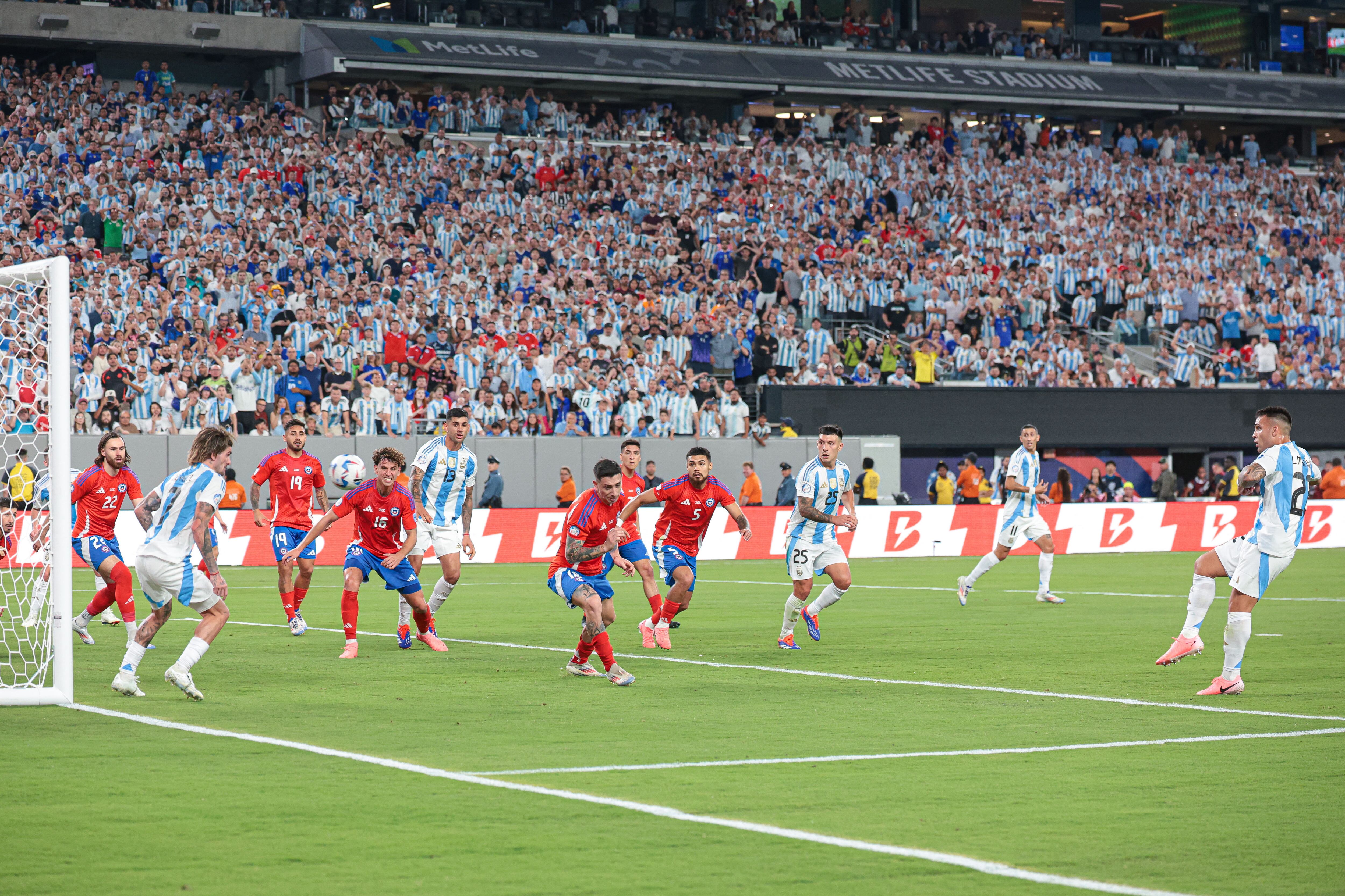 Jun 25, 2024; East Rutherford, NJ, USA; Argentina forward Lautaro Martinez (22) scores a goal during the second half against Chile at MetLife Stadium. Mandatory Credit: Vincent Carchietta-USA TODAY Sports