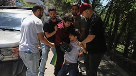 People are detained by police as they attempt to hold a Pride march, in Istanbul, Turkey, Sunday, June 28, 2026. (AP Photo/Dilara Acikgoz)