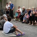 Pensioners wait outside Oschadbank to receive pension money in Siversk, in Donetsk Oblast, eastern Ukraine, on July 8, 2022, amid the Russian invasion of Ukraine. (Photo by MIGUEL MEDINA / AFP)