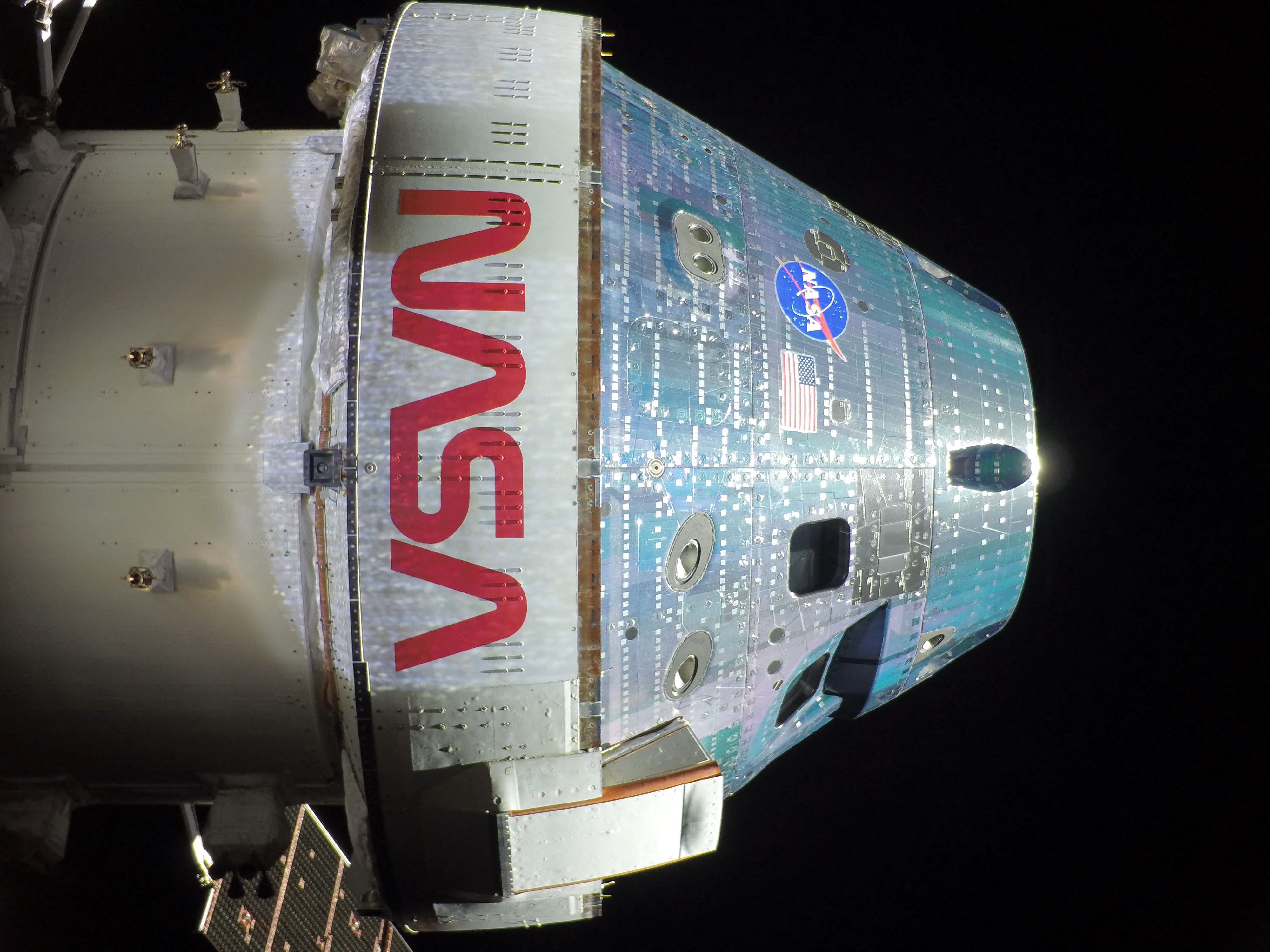 This handout picture provided by NASA shows the Orion spacecraft captured by a camera mounted on one of its solar array wings during a routine external inspection of the spacecraft on the second day into the Artemis II mission, on April 3, 2026. As Artemis II astronauts forged ahead on their lunar mission, NASA released initial images taken from the Orion spacecraft, including a full portrait of Earth featuring its deep blue oceans and billowing clouds. After a flurry of high-stakes activity including a dramatic blast-off and an engine firing that catapulted them on their historic trajectory to circle the Moon, the four astronauts aboard were able to catch their breath, even as they continued to perform a variety of equipment checks and tests. (Photo by NASA / AFP) / RESTRICTED TO EDITORIAL USE - MANDATORY CREDIT "AFP PHOTO / NASA" - NO MARKETING NO ADVERTISING CAMPAIGNS - DISTRIBUTED AS A SERVICE TO CLIENTS