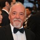 (FILES) In this file photo taken on May 25, 2012, Brazilian writer Paulo Coelho smiles as he arrives for the screening of the film "Cosmopolis" presented in competition at the 65th Cannes film festival in Cannes, France. - Brazilian writer Paulo Coelho offered on July 14, 2021 to finance a jazz festival that had a request for public resources rejected by the government of Jair Bolsonaro, after defining himself as "anti-fascist". (Photo by Alberto PIZZOLI / AFP)