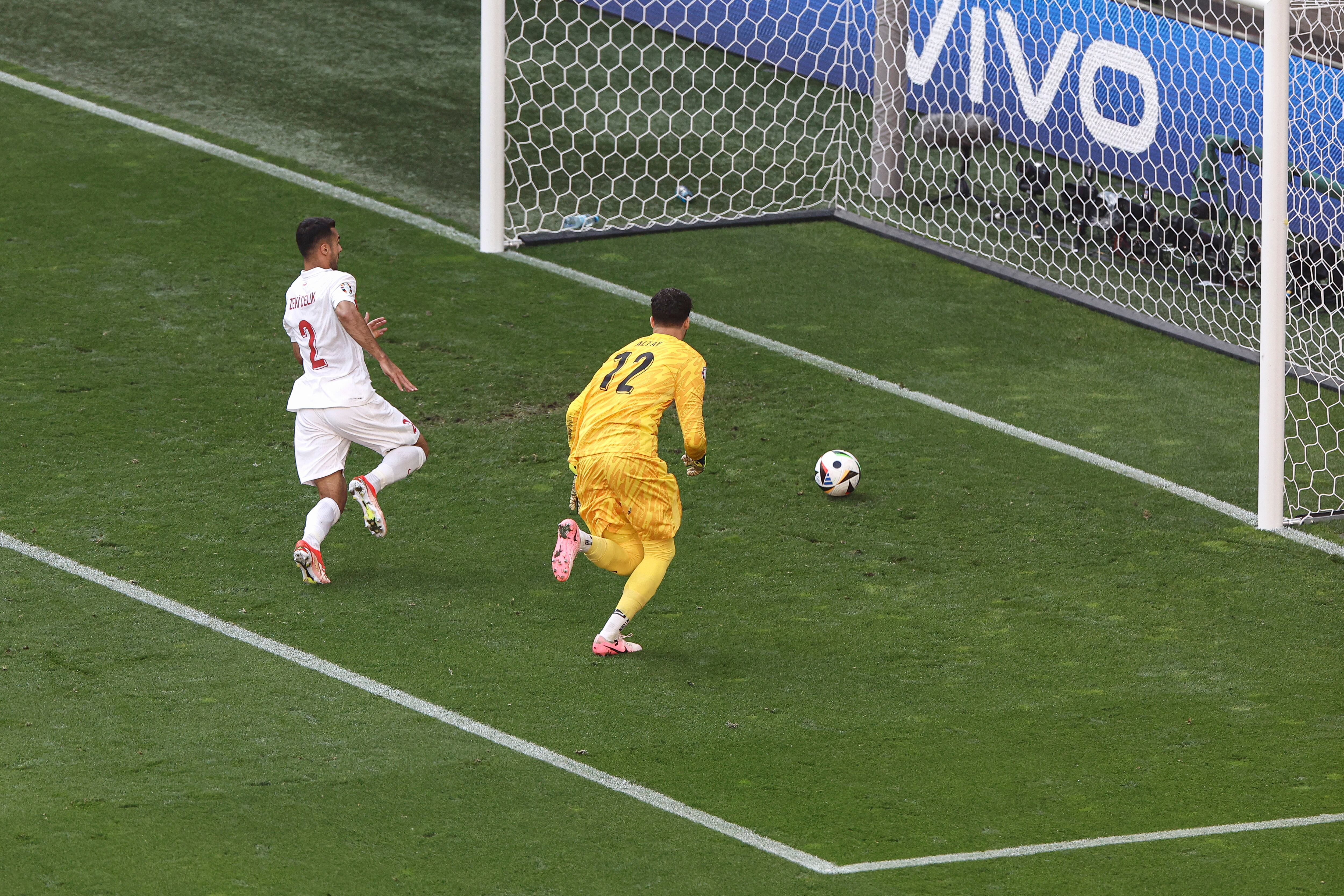 Turkey's goalkeeper #12 Altay Bayindir and defender #02 Zeki Celik run to save their own goal during the UEFA Euro 2024 Group F football match between Turkey and Portugal at the BVB Stadion in Dortmund on June 22, 2024. (Photo by KENZO TRIBOUILLARD / AFP)