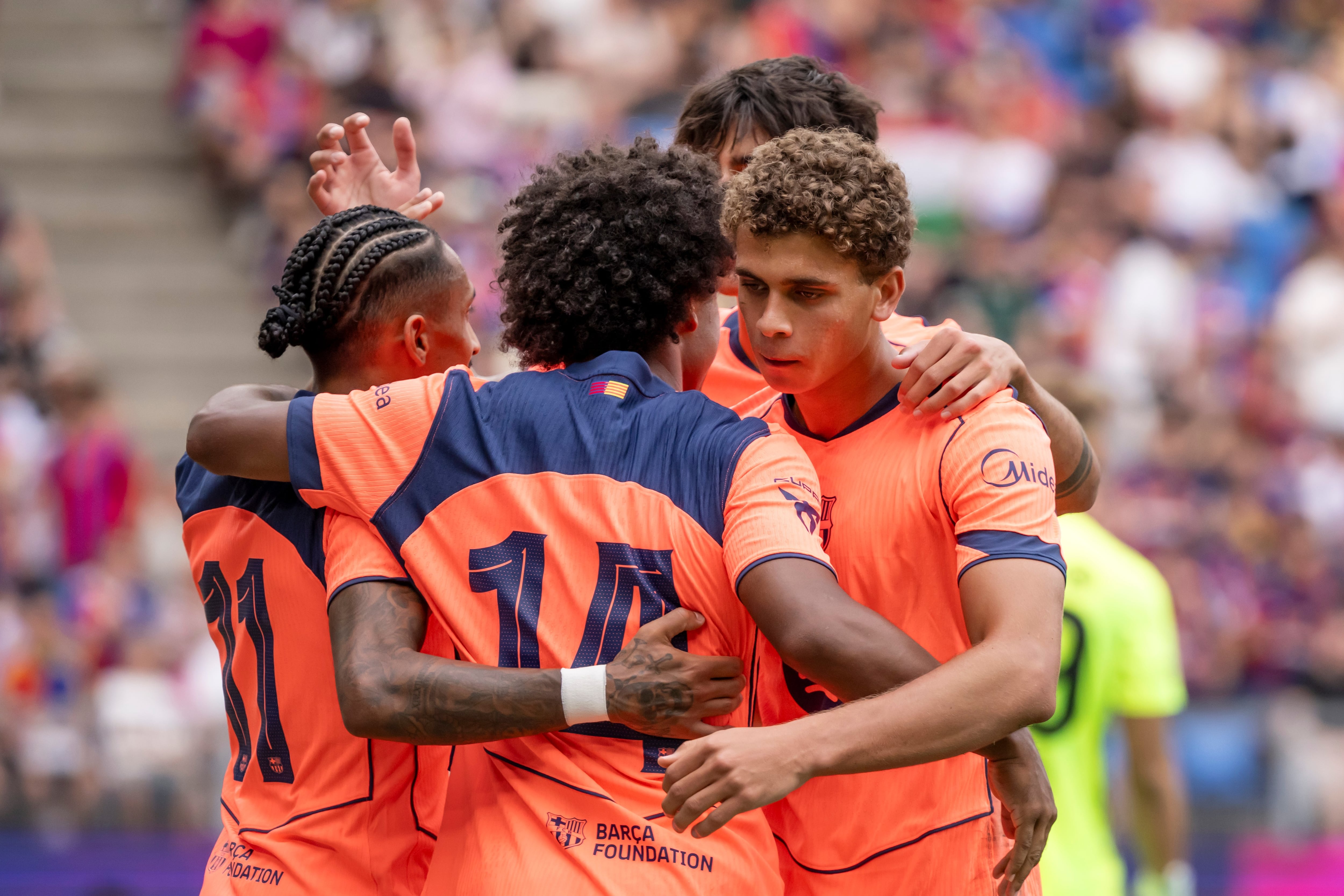Barcelona's Hamza Abdelkarim, right, cheers after scoring during a pre-season soccer match between FC Basel 1893 and FC Barcelona in Basel, Switzerland, Sunday, Aug. 16, 2026. (Georgios Kefalas/Keystone via AP)