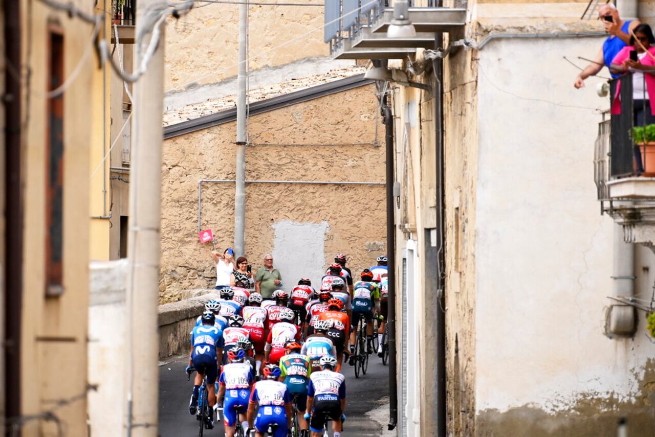 Cyclists pedal along a village during the third stage of the Giro d'Italia, tour of Italy cycling race from Enna to Etna, Sicily, Monday, Oct. 5, 2020. (Fabio Ferrari/LaPresse via AP)