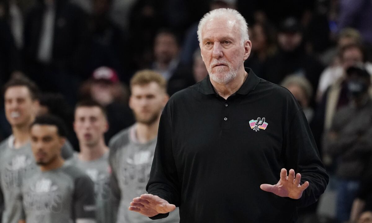 San Antonio Spurs head coach Gregg Popovich signals to his players during the second half of an NBA basketball game against the Utah Jazz, Friday, March 11, 2022, in San Antonio. The Spurs won, making Popovich the all-time winningest coach in NBA regular-season history. (AP/Eric Gay)