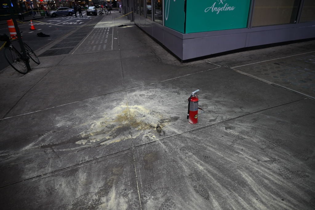MANHATTAN, NEW YORK, UNITED STATES - MARCH 16: A view of the crime scene as members of the NYPD Crime Scene Unit investigate the scene and canvass the area while looking at evidence including a fire extinguisher, jacket and other pieces of evidence at the gruesome scene where a man was set on fire in the heart of Times Square early Sunday morning at Broadway and West 41st Street in Midtown Manhattan, New York, United States March 16, 2025. The NYPD is searching for a suspect who set a man on fire in Midtown early Sunday morning. Police received a 911 call at 3:55 a.m. about a person on fire at 41st Street and 7th Avenue. When police arrived at the scene, a 49-year-old man told them that a male suspect had approached him, thrown a liquid on him and started a fire.The victim suffered burns to his face and arms. The NYPD Crime Scene Unit is on the scene. (Photo by Kyle Mazza/Anadolu via Getty Images)