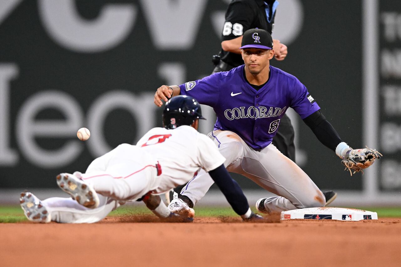 BOSTON, MASSACHUSETTS - JULY 08: Ceddanne Rafaela #3 of the Boston Red Sox slides safely into second base as the ball goes wide of Ryan Ritter #8 of the Colorado Rockies during the fifth inning at Fenway Park on July 08, 2025 in Boston, Massachusetts. (Photo by Brian Fluharty/Getty Images)