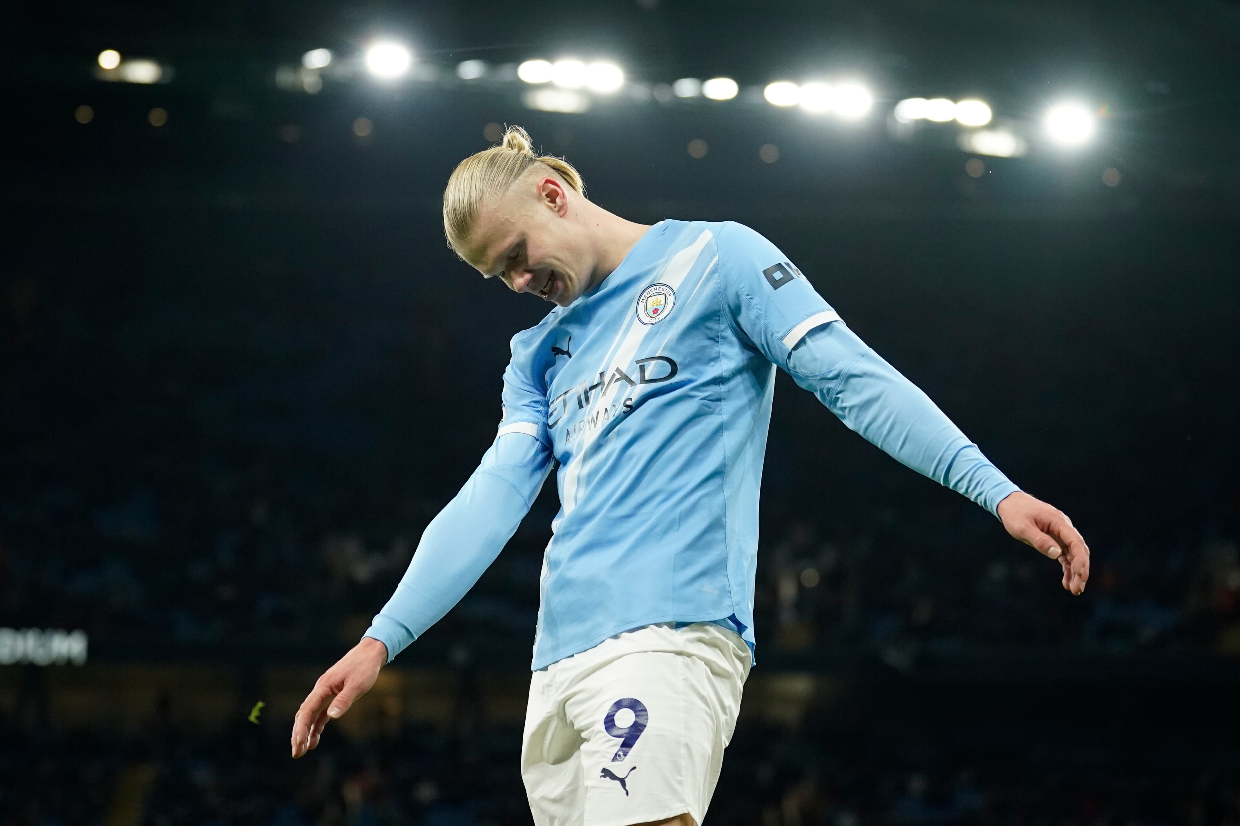 Manchester City's Erling Haaland reacts after missing a chance to score a goal during the English Premier League soccer match between Manchester City and West Ham United in Manchester, England, Saturday, Dec. 20, 2025. (AP Photo/Dave Thompson)