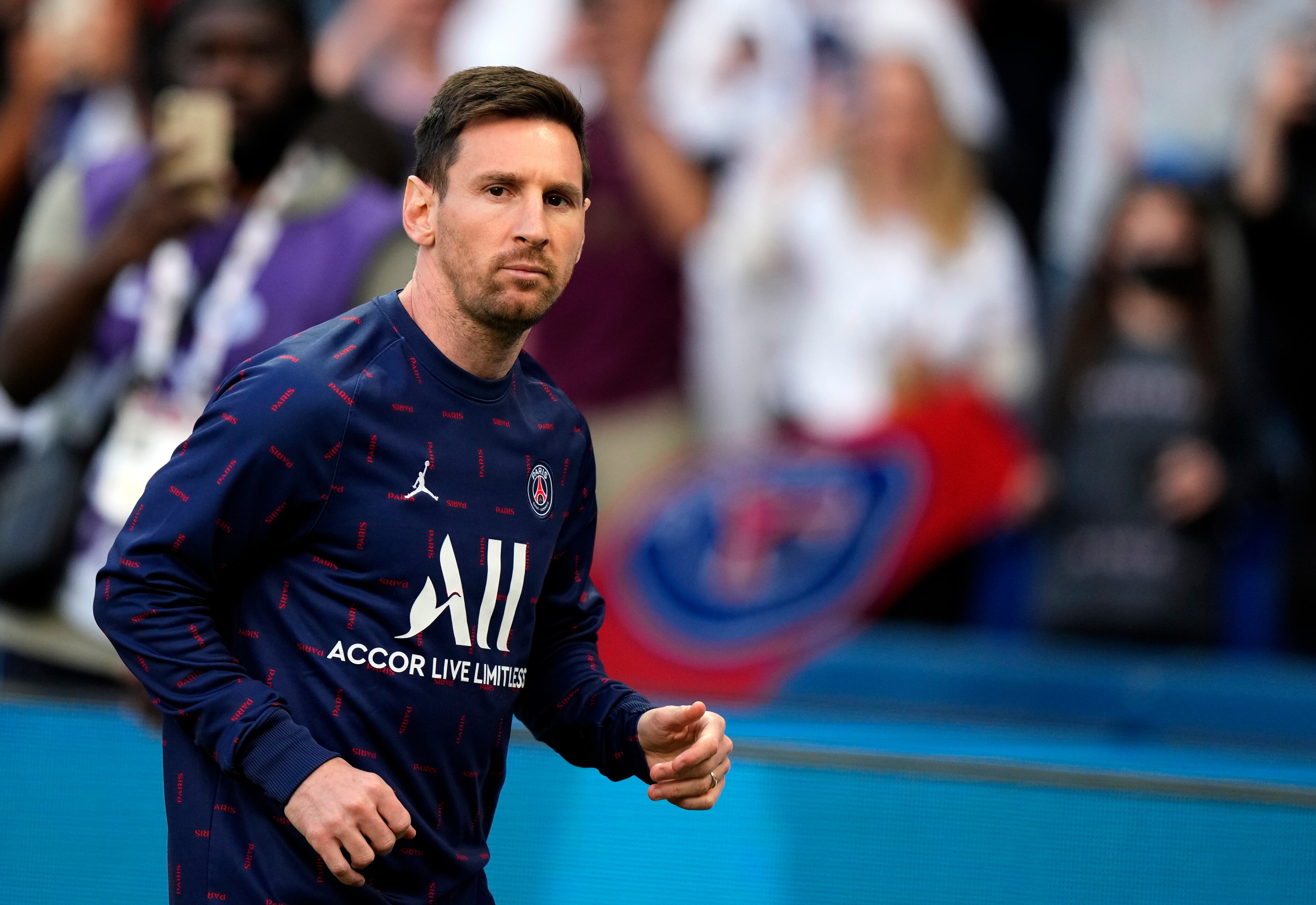 PSG's Lionel Messi runs during the warm up before the League One soccer match between Paris Saint Germain and Marseille, at the Parc des Princes stadium, in Paris, France, Sunday, April 17, 2022. (AP Photo/Francois Mori)
