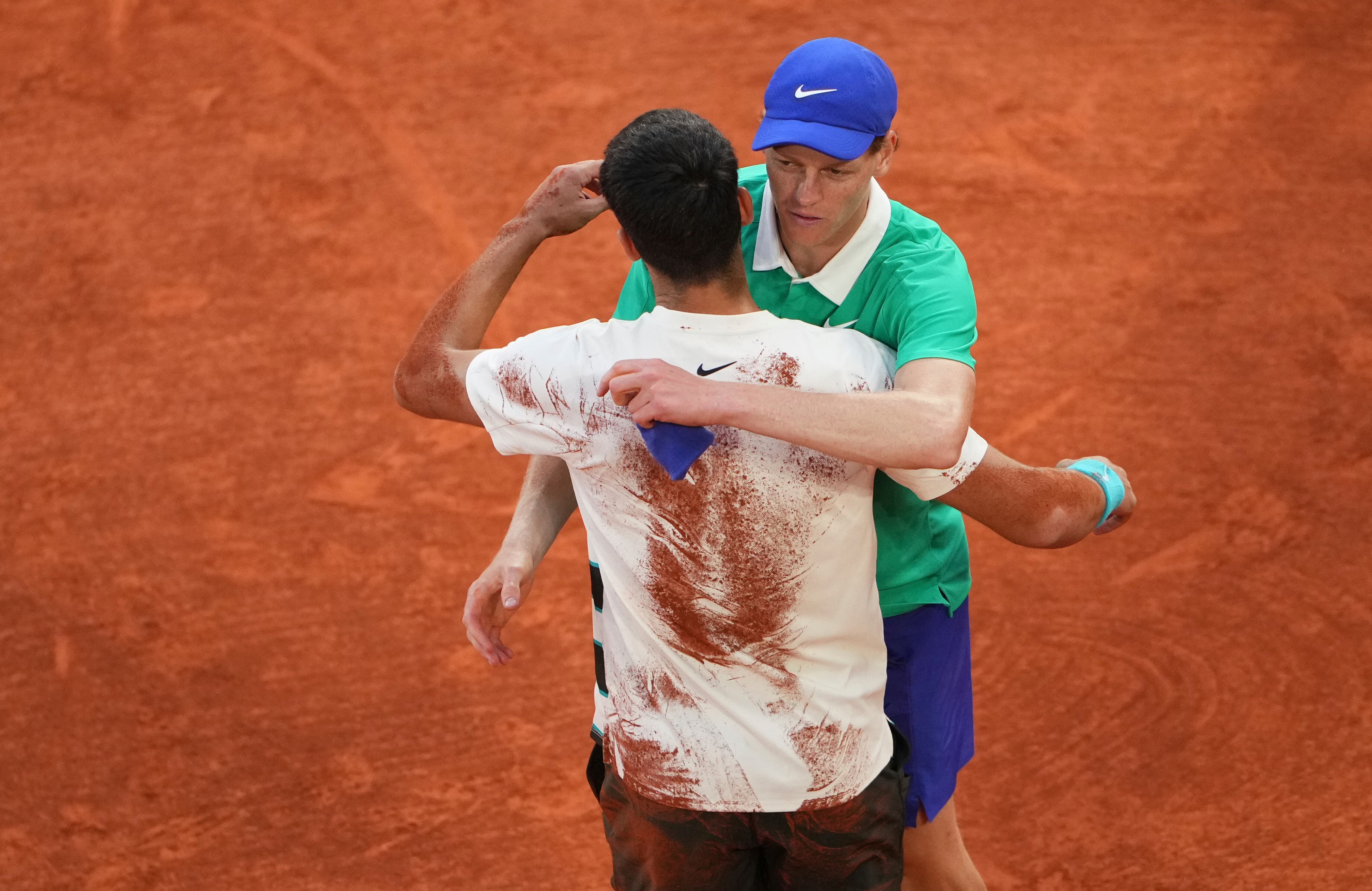 Winner Spain's Carlos Alcaraz, left, and Italy's Jannik Sinner hug after their final match of the French Tennis Open at the Roland-Garros stadium in Paris, Sunday, June 8, 2025. (AP Photo/Lindsey Wasson)