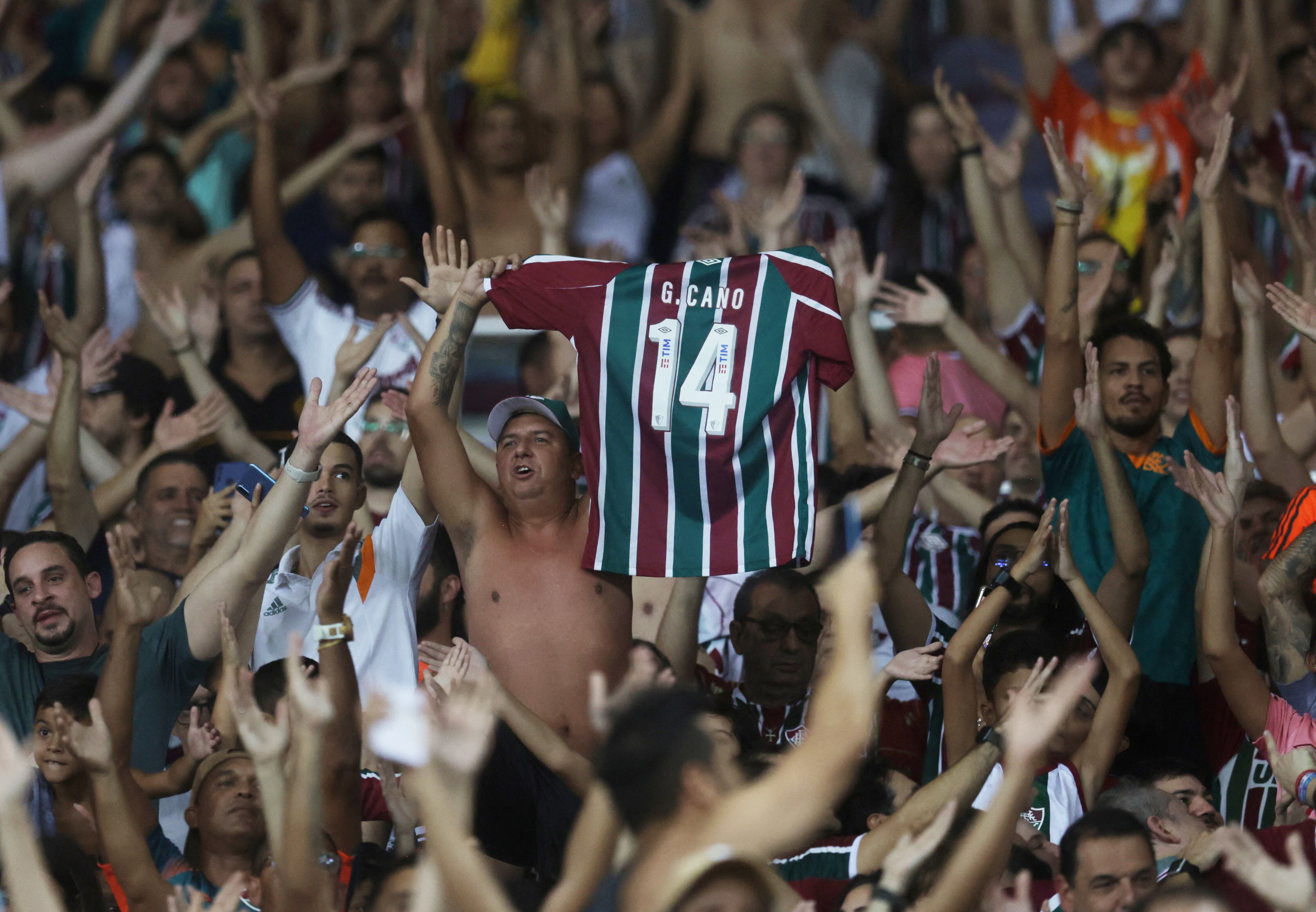 Soccer Football - Copa Libertadores -  Group D - Fluminense v River Plate - Estadio Maracana, Rio de Janeiro, Brazil - May 2, 2023 Fluminense fans celebrate after the match with a German Cano replica shirt REUTERS/Ricardo Moraes
