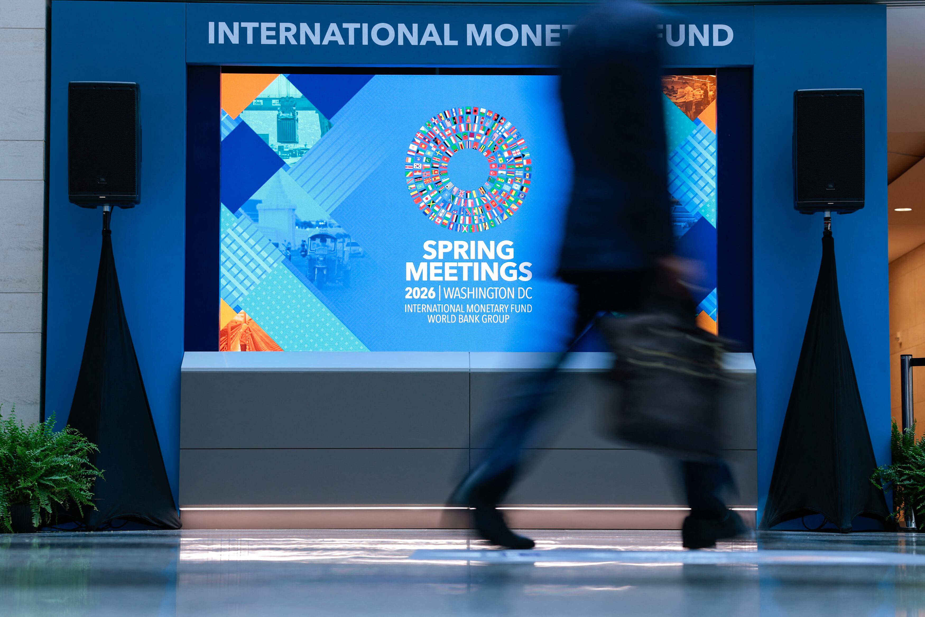 A man walks through the atrium during the 2026 IMF and World Bank Group Spring Meetings in Washington, DC, on April 14, 2026. (Photo by Kent NISHIMURA / AFP)