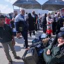 Palestinians, some with foreign passports hoping to cross into Egypt and others waiting for aid wait at the Rafah crossing in the southern Gaza strip, on October 16, 2023. The death toll from Israeli strikes on the Gaza Strip has risen to around 2,750 since Hamas's deadly attack on southern Israel last week, the Gaza health ministry said October 16. Some 9,700 people have also been injured as Israel continued its withering air campaign on targets in the Palestinian coastal enclave, the Hamas-controlled ministry added. (Photo by Mohammed ABED / AFP)