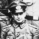 German SS officer and Nazi war criminal Klaus Barbie (1913 - 1991) in army NCO uniform, 1944. After the war, Barbie worked for British and American intelligence services before going into hiding in Bolivia in 1955. He was arrested for war crimes in 1984 and sentenced to life imprisonment in 1987. (Photo by Gabriel Hackett/Hulton Archive/Getty Images)