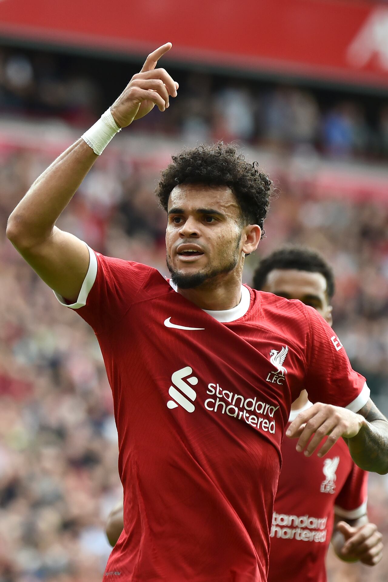 Liverpool's Luis Diaz celebrates after scoring his sides first goal during the Premier League soccer match between Liverpool and AFC Bournemouth at Anfield, in Liverpool, England, Saturday, Aug. 19, 2023. (AP Photo/Rui Vieira)