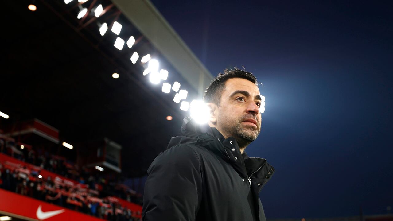 Barcelona's head coach Xavi Hernández arrives at the bench during the Spanish La Liga soccer match between Granada and Barcelona at Los Carmenes stadium in Granada, Spain, Saturday, Jan. 8, 2022. (AP Photo/Fermin Rodriguez)
