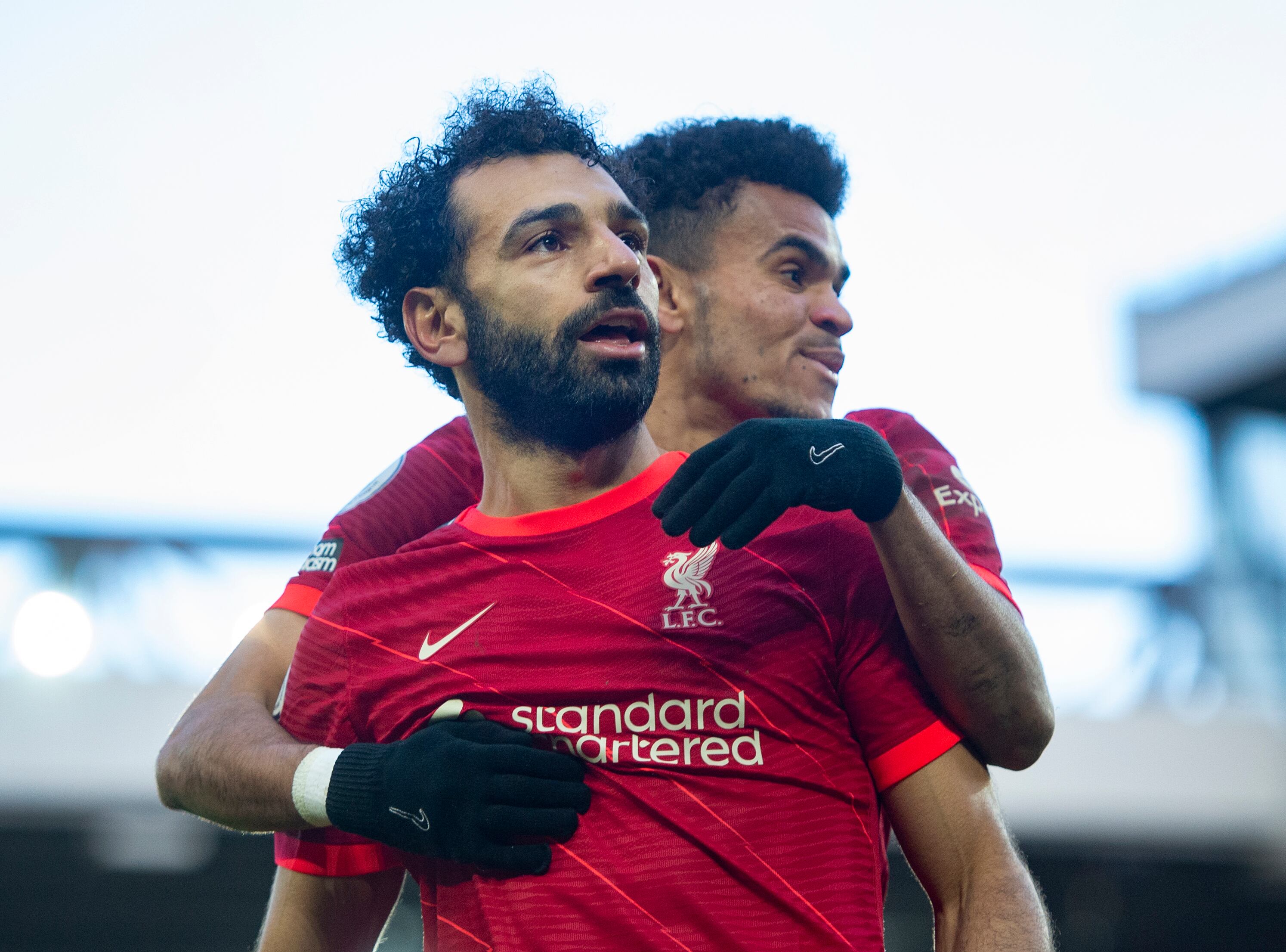 LIVERPOOL, ENGLAND - FEBRUARY 19: Mohamed Salah of Liverpool celebrates scoring his team's second goal and his one hundred and fiftieth for the club with team mate Luis Diaz  during the Premier League match between Liverpool and Norwich City at Anfield on February 19, 2022 in Liverpool, United Kingdom. (Photo by Joe Prior/Visionhaus via Getty Images)