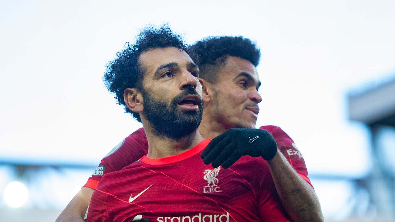 LIVERPOOL, ENGLAND - FEBRUARY 19: Mohamed Salah of Liverpool celebrates scoring his team's second goal and his one hundred and fiftieth for the club with team mate Luis Diaz during the Premier League match between Liverpool and Norwich City at Anfield on February 19, 2022 in Liverpool, United Kingdom. (Photo by Joe Prior/Visionhaus via Getty Images)