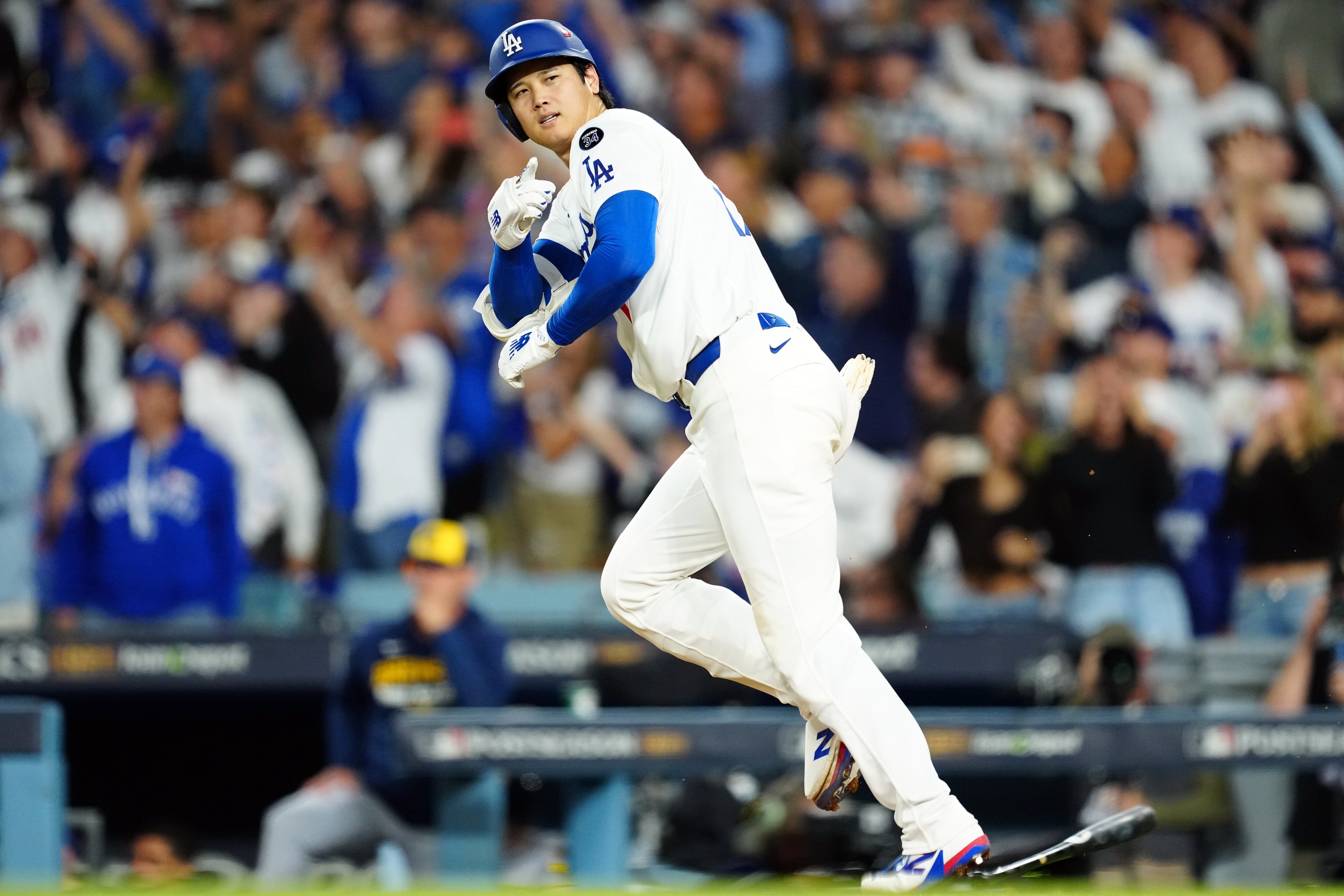 LOS ANGELES, CA - OCTOBER 17: Shohei Ohtani #17 of the Los Angeles Dodgers hits a solo home run in the seventh inning during Game Four of the National League Championship Series presented by loanDepot between the Milwaukee Brewers and the Los Angeles Dodgers at Dodger Stadium on Friday, October 17, 2025 in Los Angeles, California. (Photo by Mary DeCicco/MLB Photos via Getty Images)