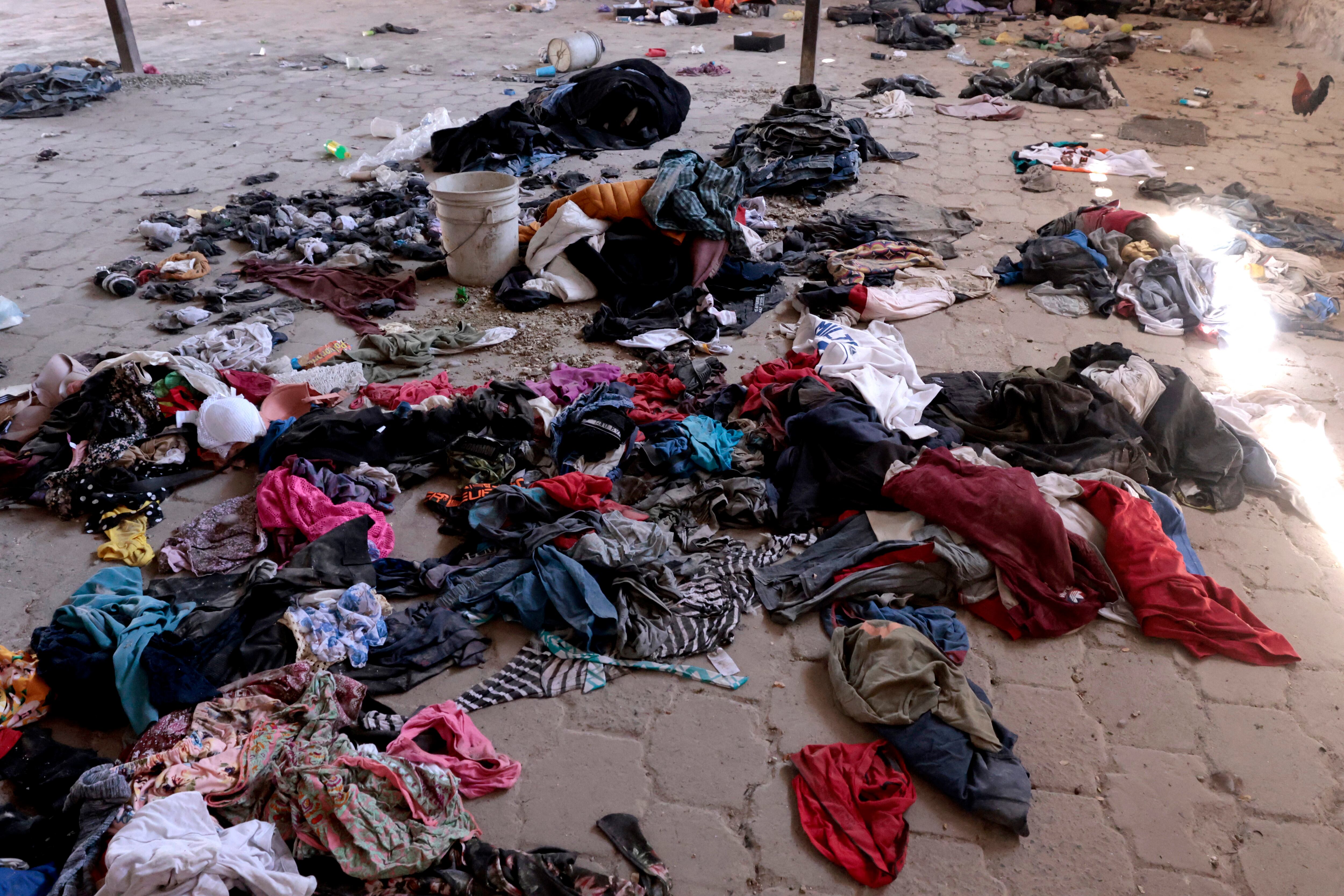 Clothes and shoes are seen at the Izaguirre Ranch in the community of La Estanzuela, where the collective 'Guerreros Buscadores' located three human crematoriums while searching for their relatives in Teuchitlan, Jalisco state, Mexico on March 5, 2025. Mexico's Attorney General's Office and the federal government will investigate alleged clandestine crematoriums located in a rural area of the western Mexican state of Jalisco, local authorities said on March 12. (Photo by ULISES RUIZ / AFP)