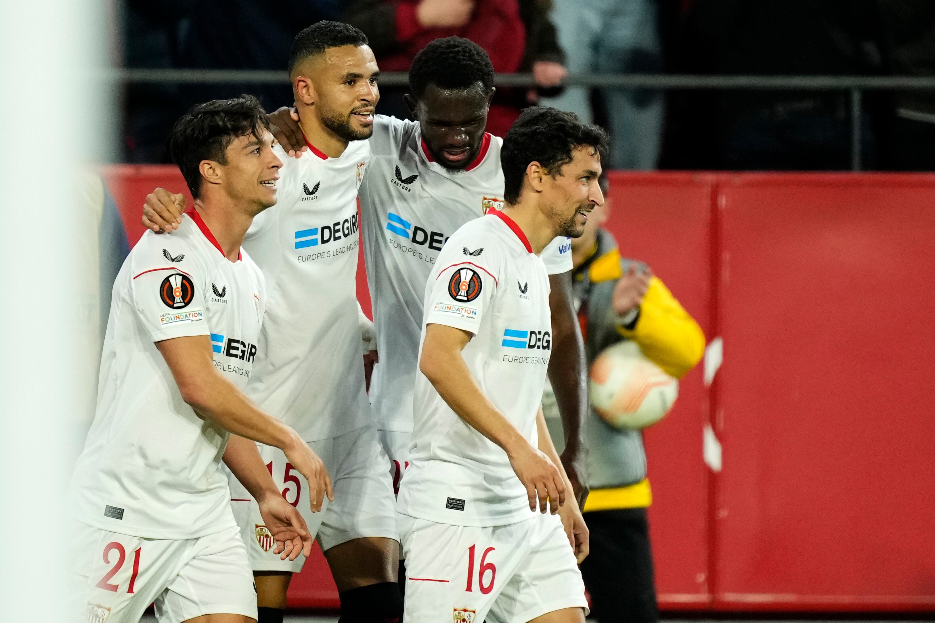 Sevilla's Youssef En-Nesyri celebrates with teammates after scoring his side's opening goal during the Europa League playoff first leg soccer match between Sevilla and PSV, at the Ramon Sanchez Pizjuan stadium in Seville, Spain, Thursday, Feb. 16, 2023. (AP Photo/Jose Breton)