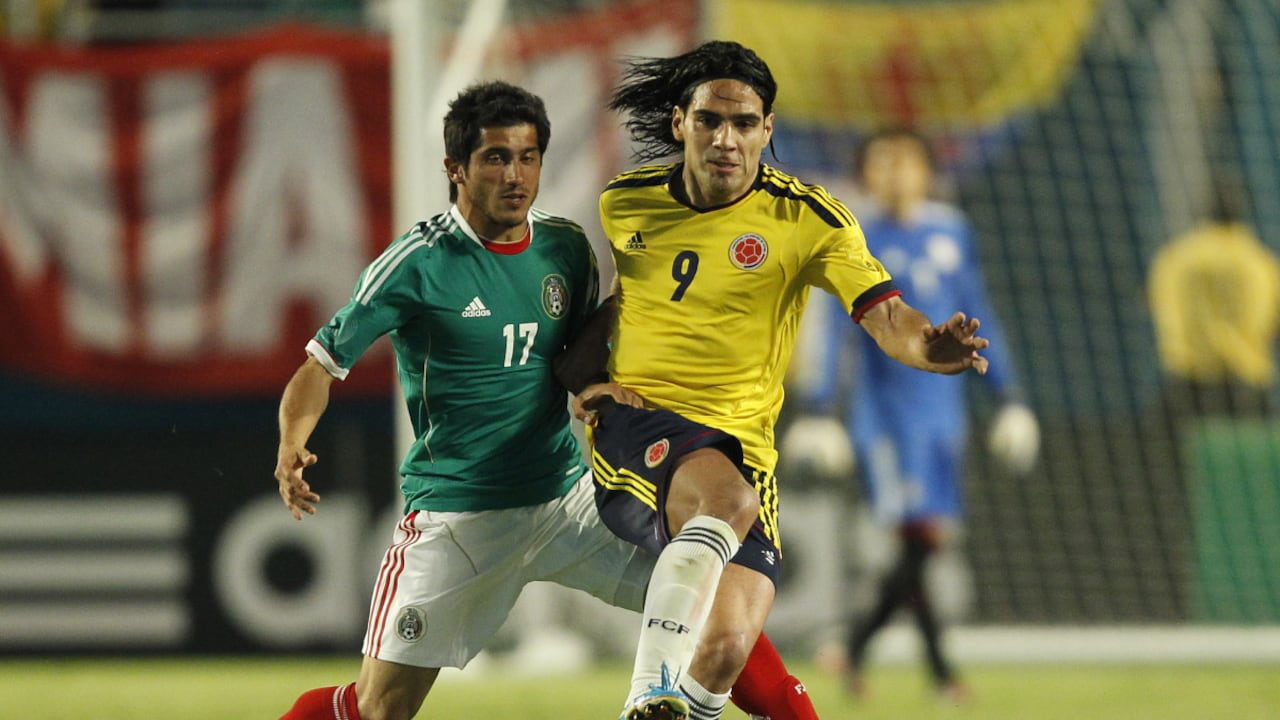 MIAMI GARDENS, FL - FEBRUARY 29: Radamel Falcao Garcia #9 of Colombia and Damian Alvarez #17 of Mexico battle for control of the ball on February 29, 2012 during an International friendly at Sun Life Stadium in Miami Gardens, Florida. Colombia defeated Mexico 2-0. (Photo by Getty Images/Joel Auerbach)