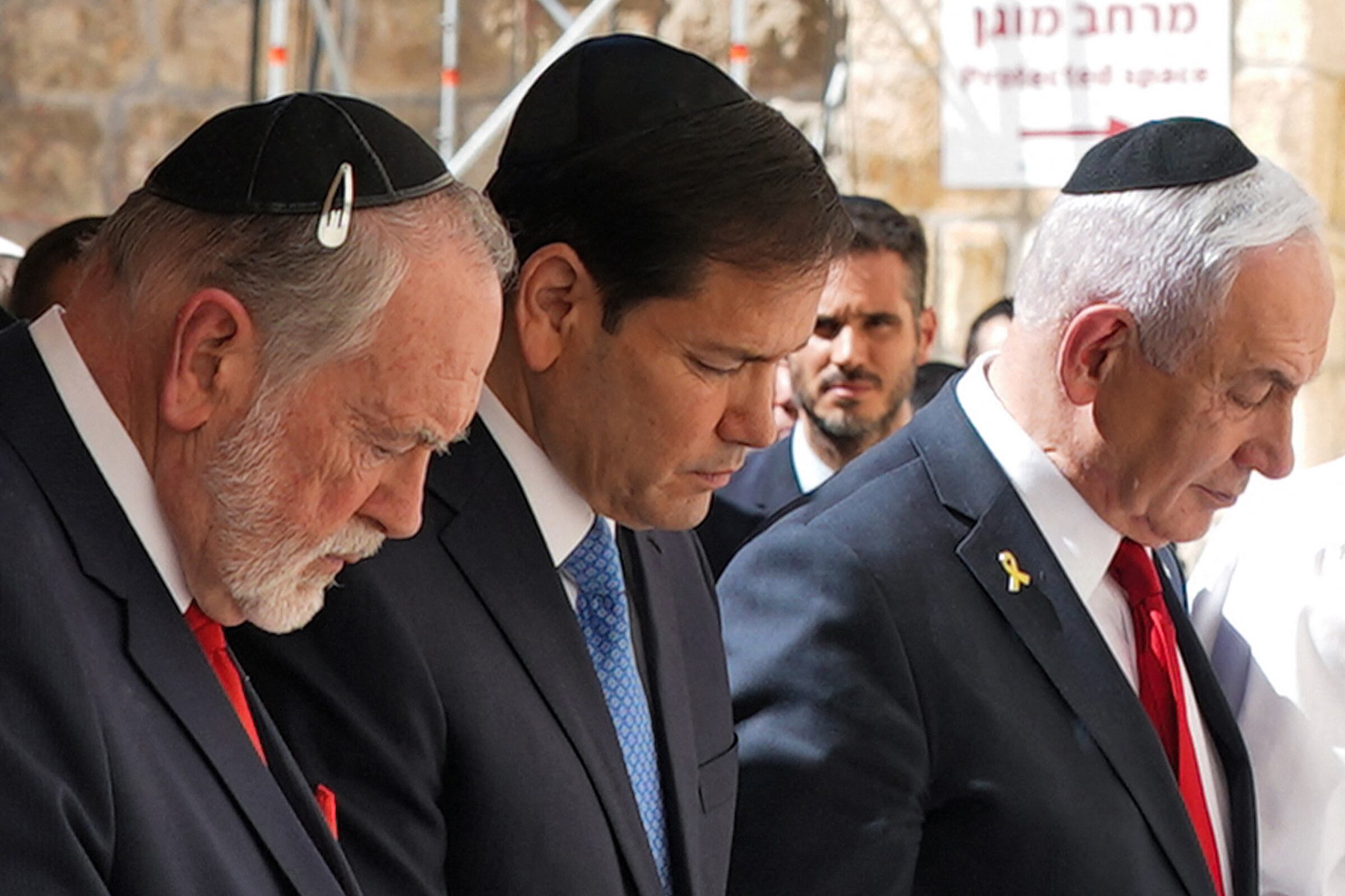 (L to R) US ambassador to Israel Mike Huckabee, Secretary of State Marco Rubio, and Israel's Prime Minister Benjamin Netanyahu visit the Western Wall, Judaism's holiest prayer site, in the old city of Jerusalem on September 14, 2025. Top US diplomat Marco Rubio began a visit to Israel on September 14, after expressing the Trump administration's unwavering support for its ally in the war with Hamas despite a strike in Qatar that drew broad criticism of Israel. (Photo by Nathan Howard / POOL / AFP)