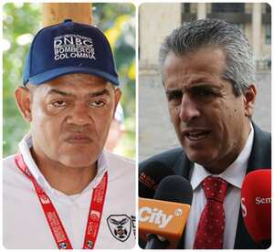 El capitán Arbey Trujillo, saliente director Nacional de Bomberos, y el ministro del Interior, Luis Fernando Velasco.