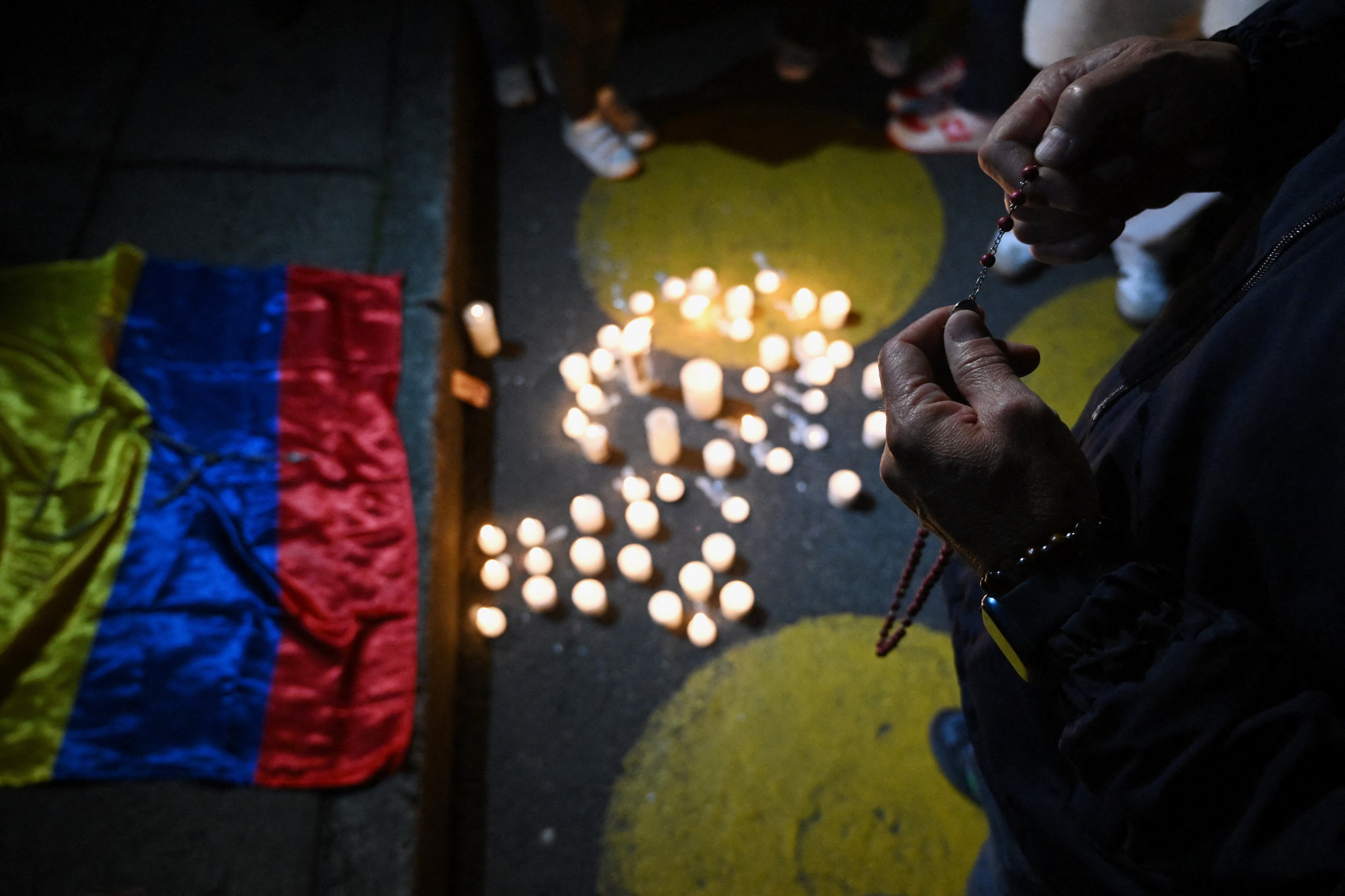 Forensic experts work at the crime scene where Senator Miguel Uribe was shot and wounded in the Modelia neighborhood in Bogota on June 7, 2025. A Colombian right-wing opposition senator and candidate for next year's presidential election, Miguel Uribe, 39, was shot and wounded in Bogota on June 7, 2025, various media reported, while the government denounced an "attack." (Photo by RAUL ARBOLEDA / AFP)