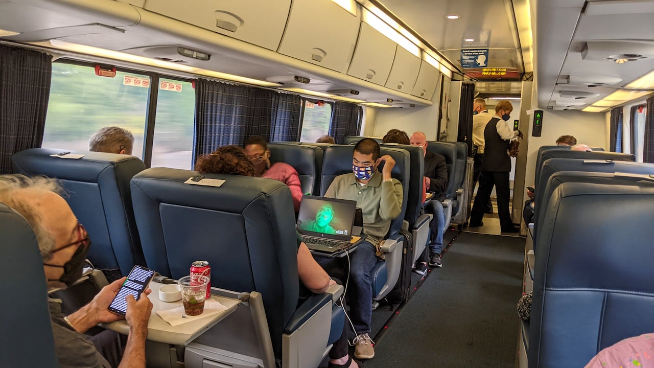 Passengers and crew wear masks on the Amtrak Acela train, first class, Washington DC to New York City.